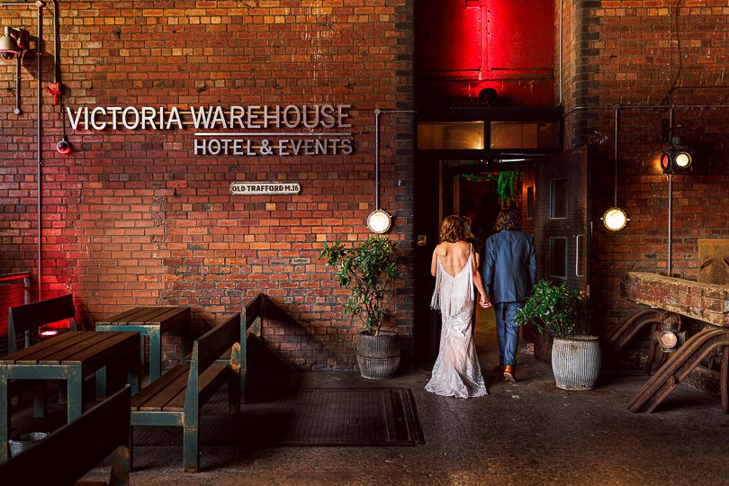 bride and groom enter Victoria Warehouse in Manchester on their wedding day