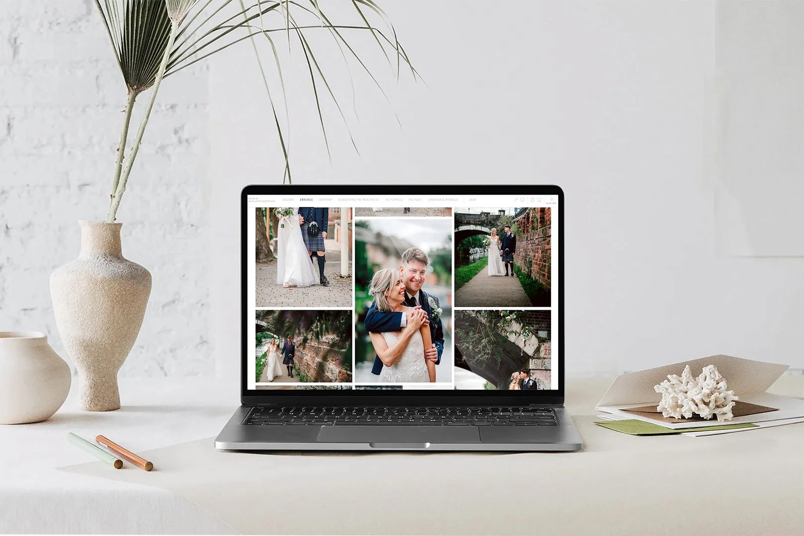 a laptop is open on a screen showing a digital wedding gallery from which images can be downloaded by the bride and groom.