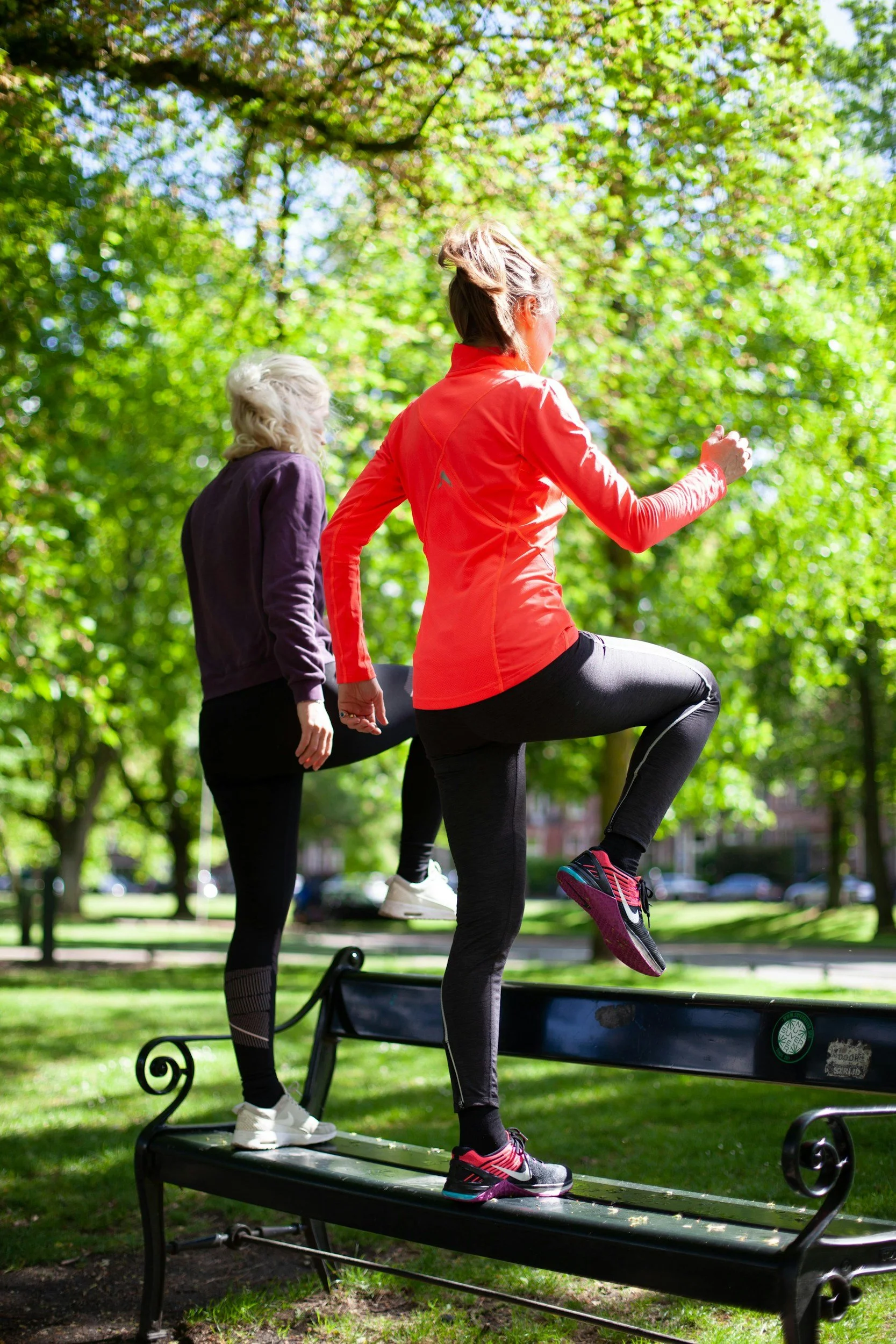 Women exercising outside in the park to improve mobility