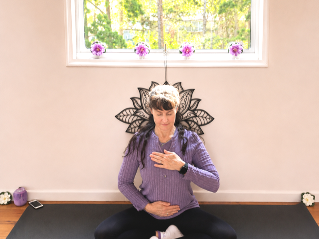 Kevala Health's Jodie demonstrating gentle breathing exercise to deeply relax