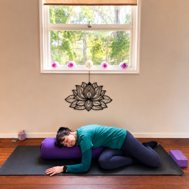 Jodie teaching a gentle yoga floor pose for back and hips