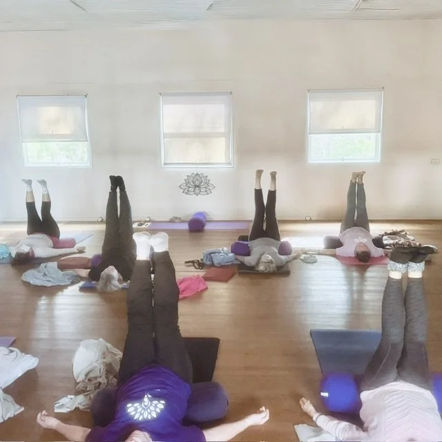 Kevala Health's Breathe & Balance Yoga class with students doing Waterfall pose to deeply relax