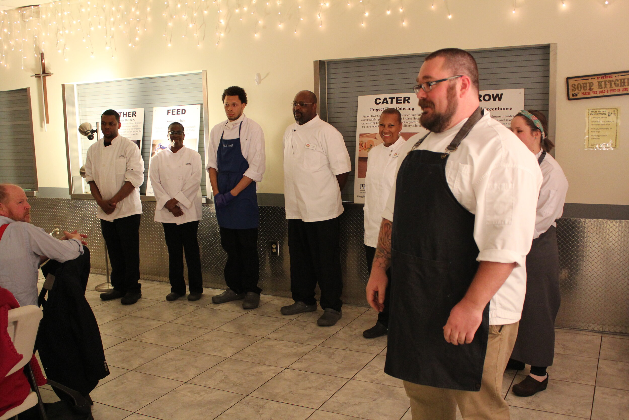  Chef Tobin introduces culinary students at a Community Dinner. 