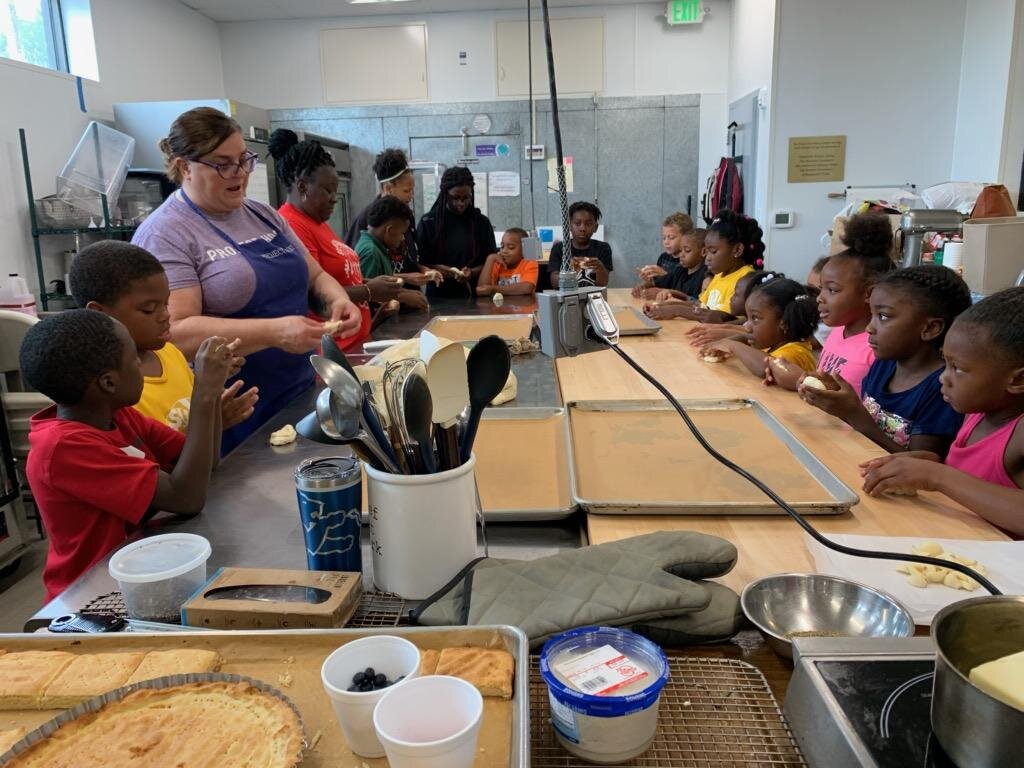  Chef Linda teaches children in Project Host’s new Bakery. 