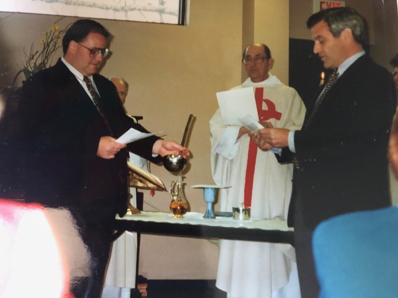  Tony Ryan (far right) reads at the Project Host Soup Kitchen dedication in 1994. 