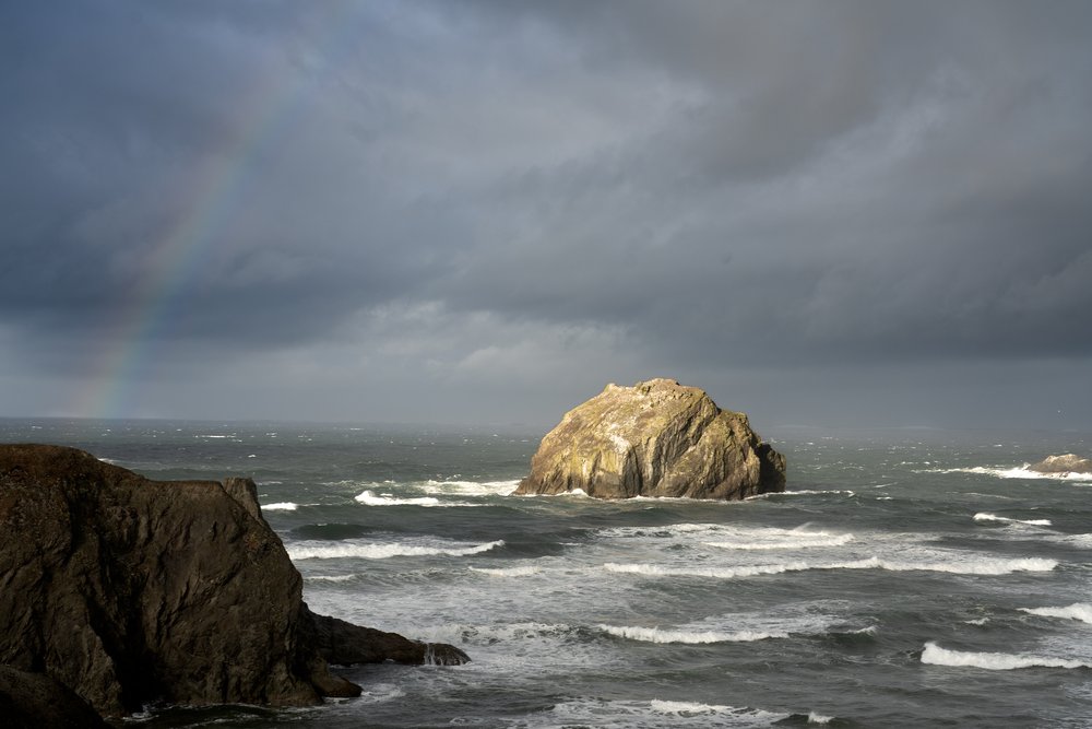 Face Rock with a rainbow