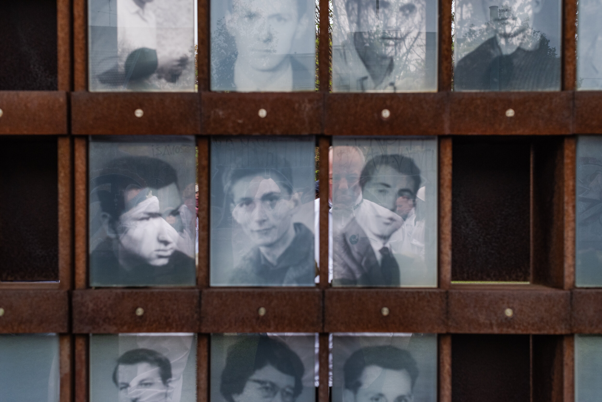  Faces of victims of a divided era on the memorial of the Wall. 