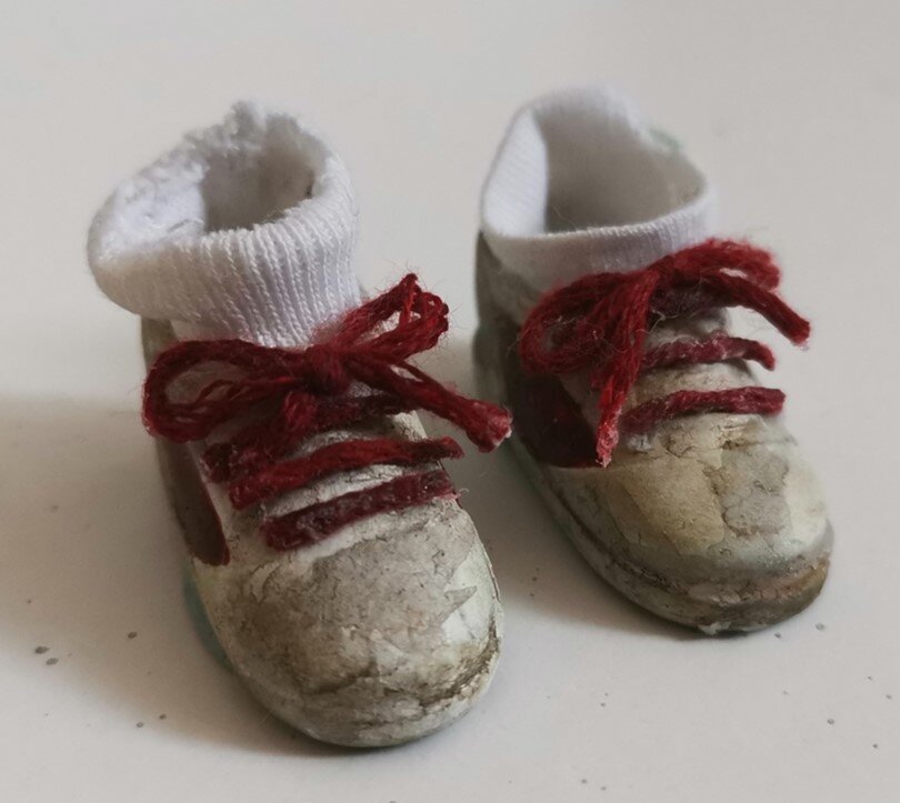 Doll shoes recycled for my stop motion animation puppet. This process involved painting, weathering and adding fabric for the details.