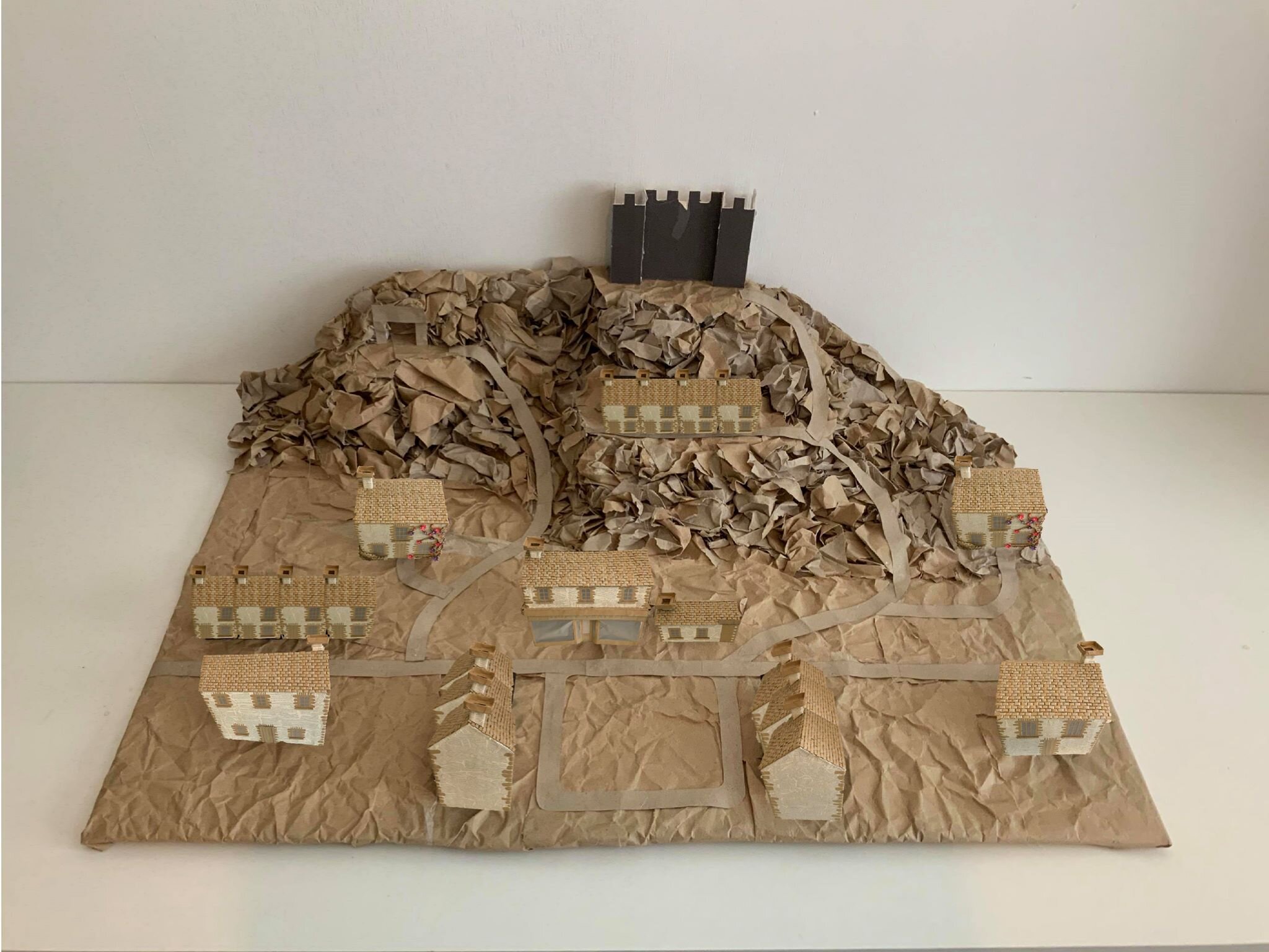 The installation is created from sustainable materials like brown paper and book paper to reflect the ideas of sustainable design, accompanied by a strong sense of narrative through the installation. These images are photoshops created to realise th