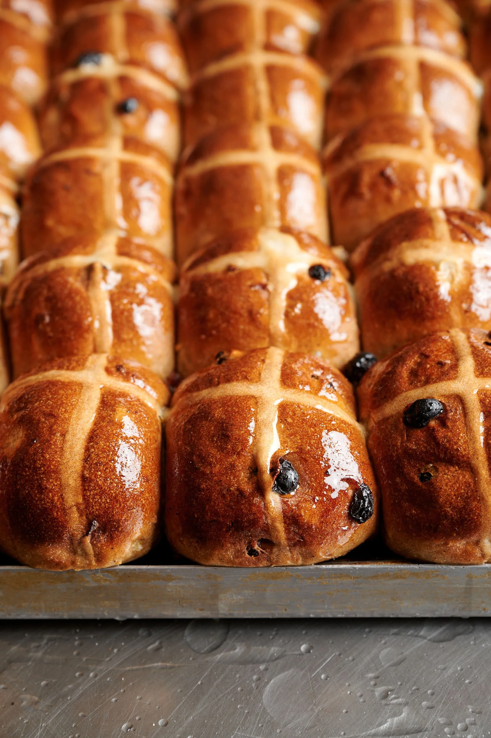Editorial food photography: hot cross buns with glaze by Melbourne food photographer Charlotte Orr