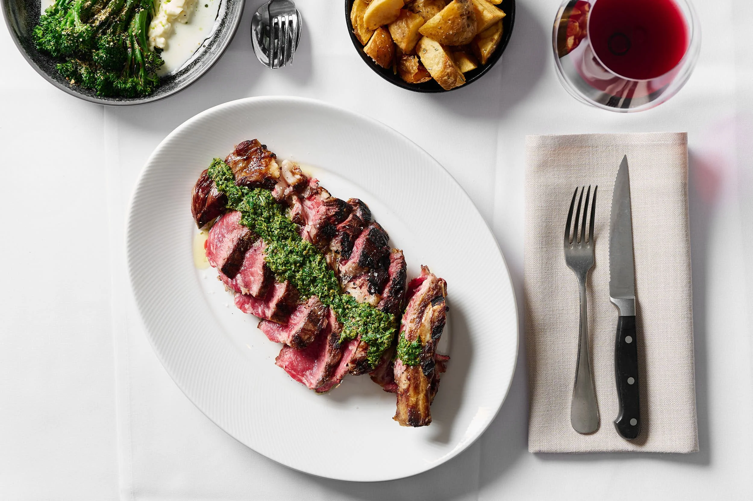 Rib Eye steak with potatoes photographed for a Melbourne restaurant by Charlotte Orr