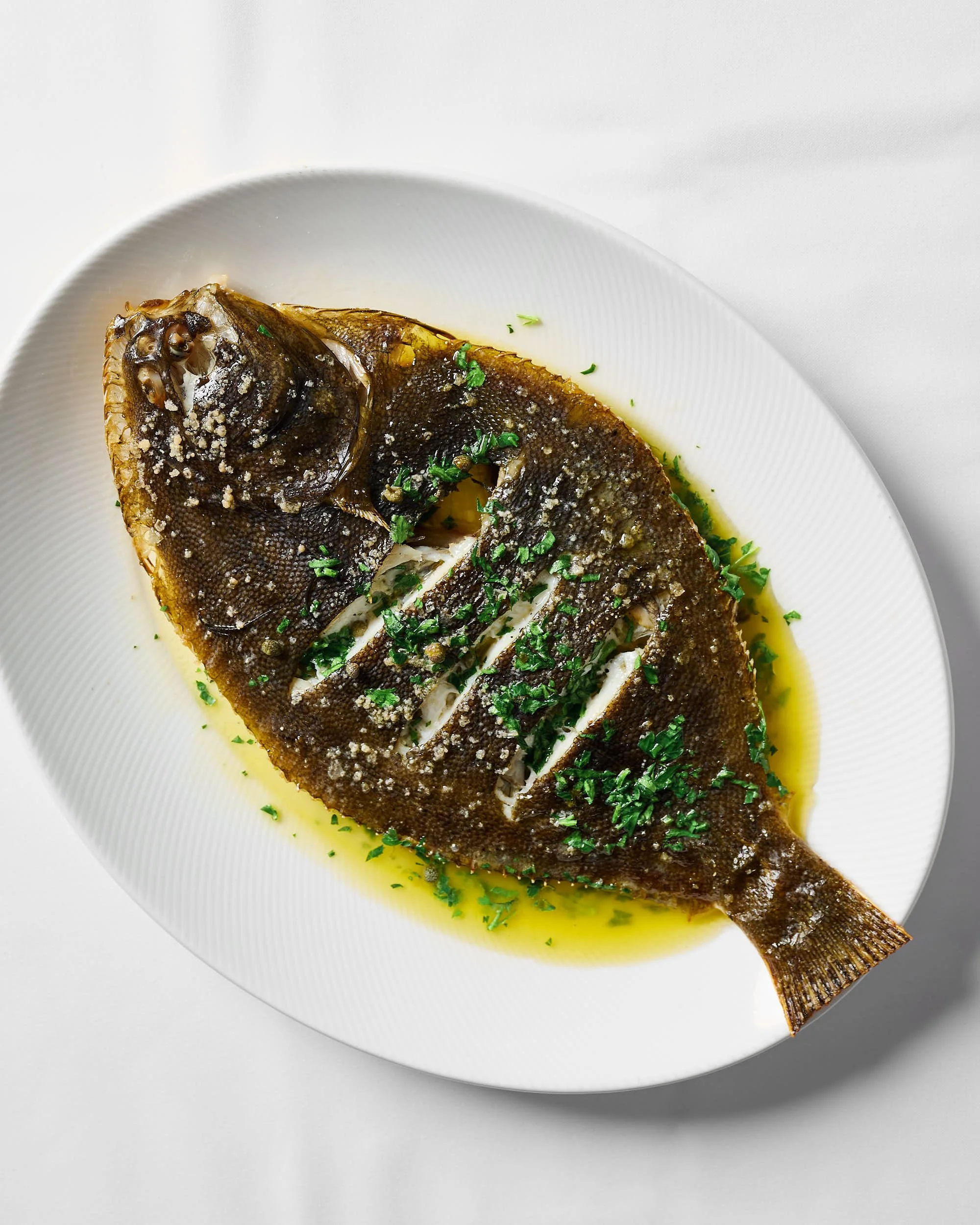 Whole flounder dish photographed for a Melbourne restaurant by Charlotte Orr