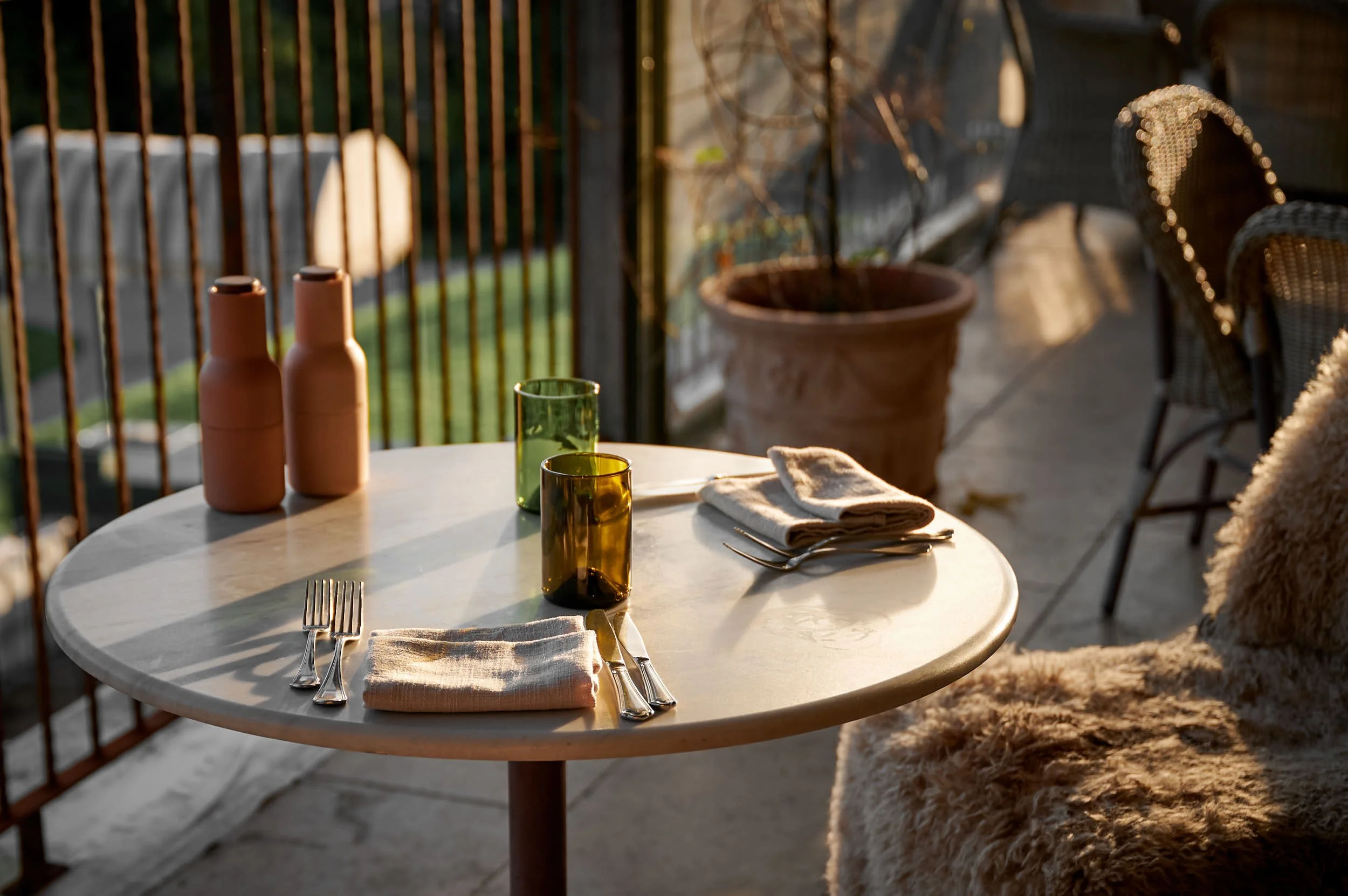 Beautiful hospitality photography: table on terrace at golden hour by Charlotte Orr, photographer based in Melbourne, Australia
