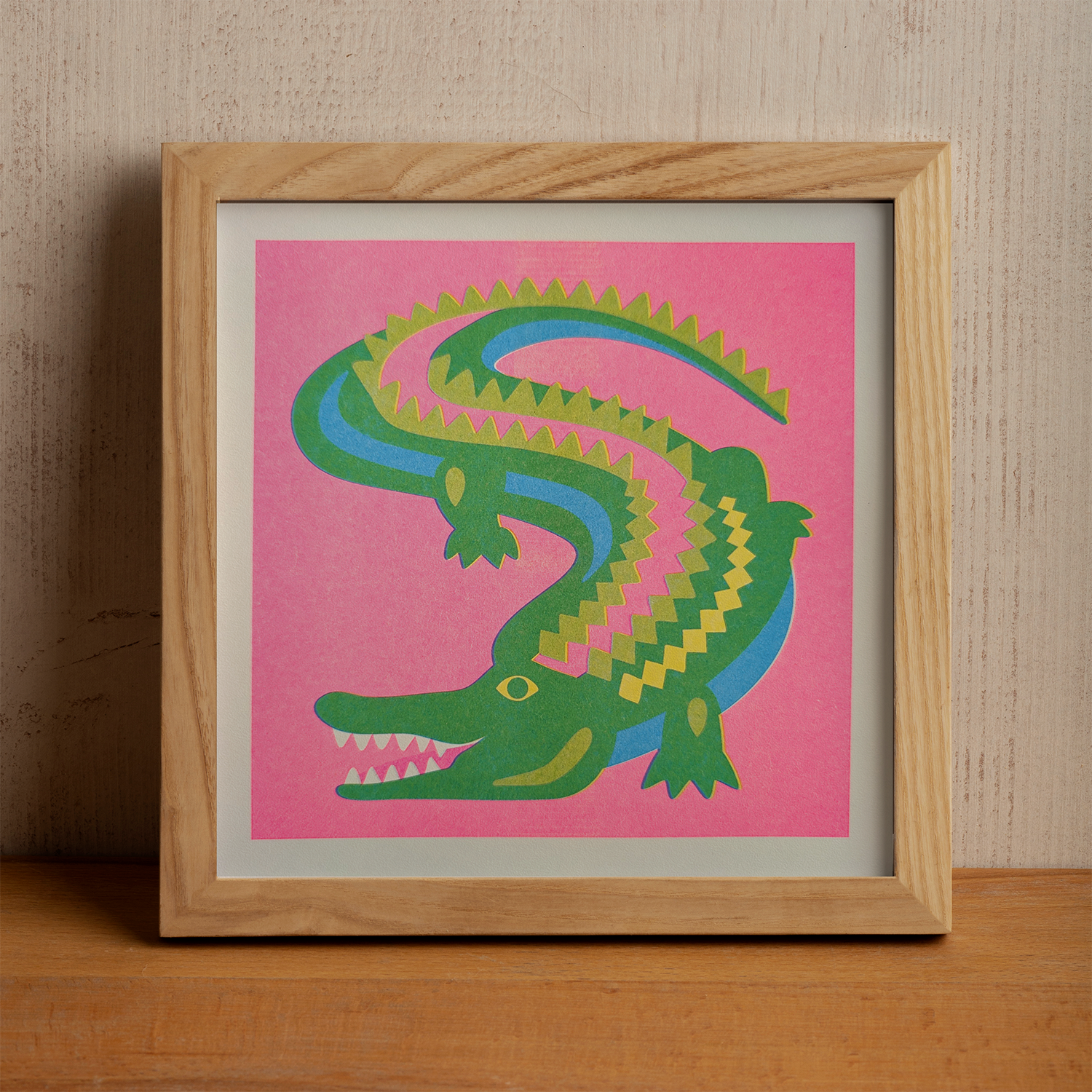alligator risograph print in wood frame.png