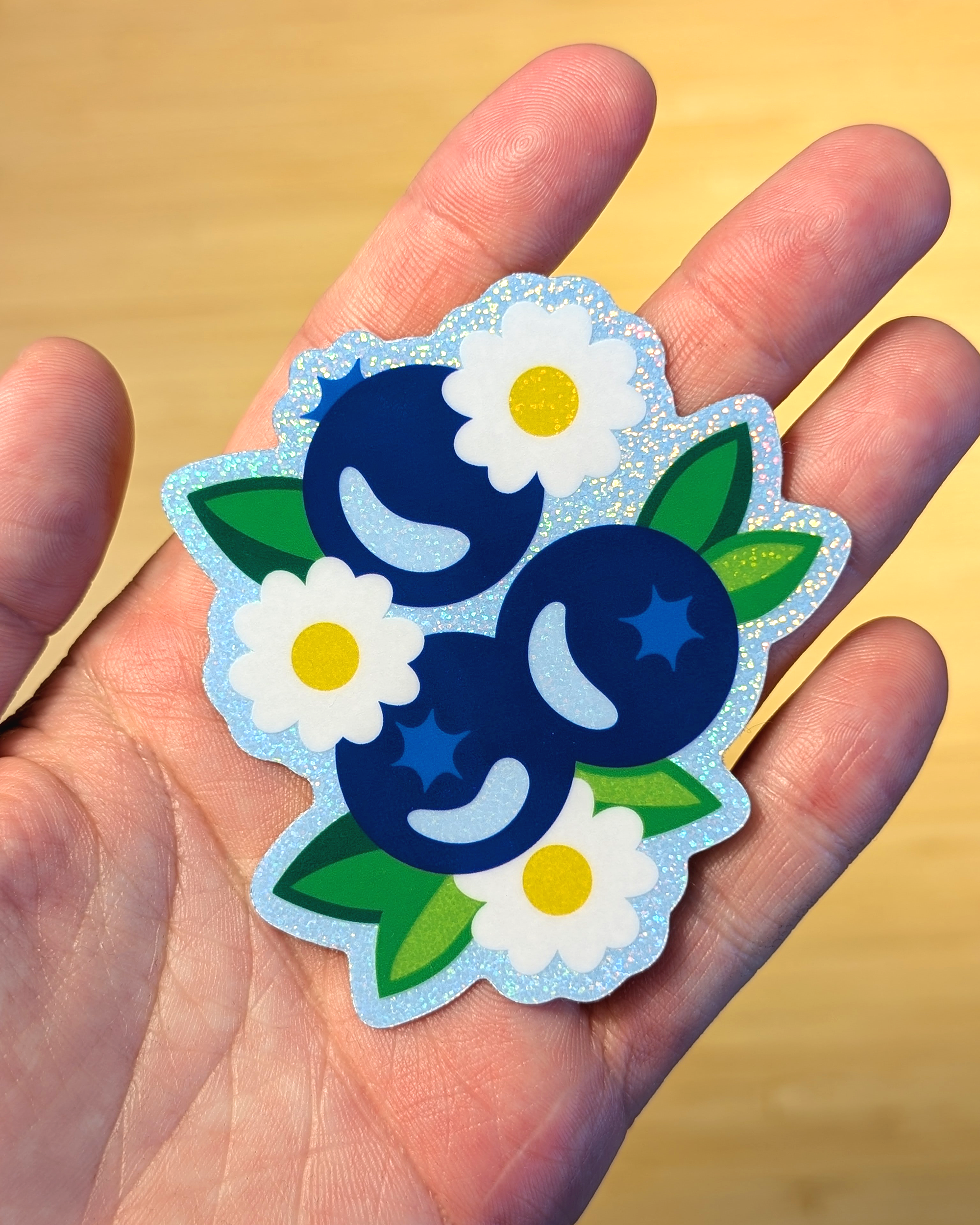 blueberries sticker in hand.png