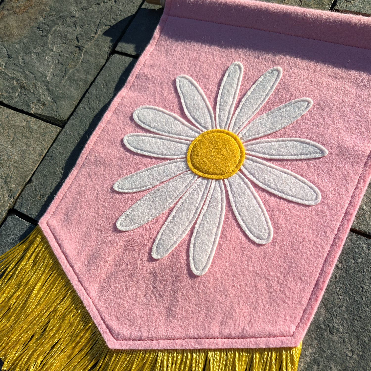 daisy banner on stone side square.png