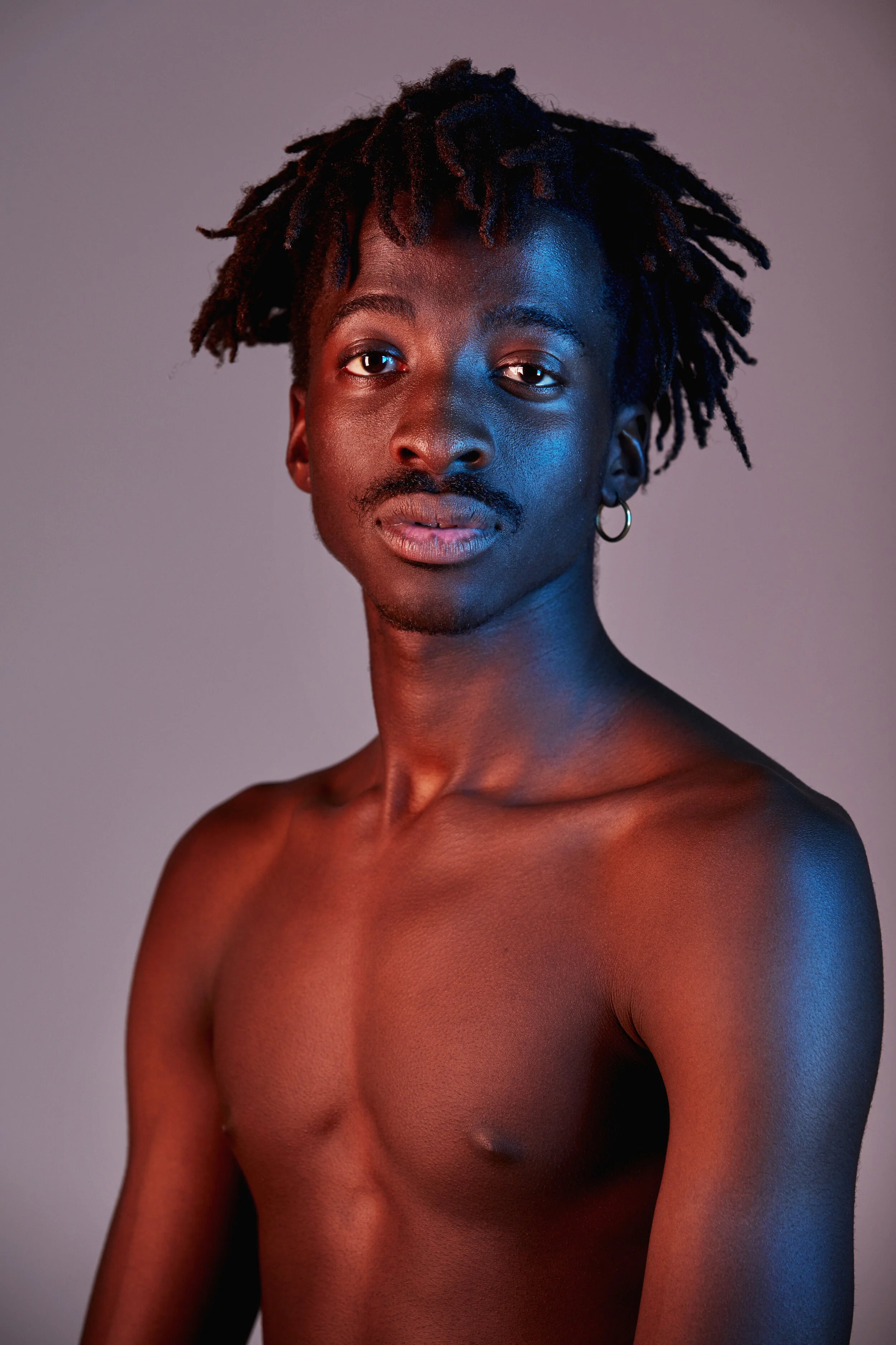 Team Member Omar Harris against purple background