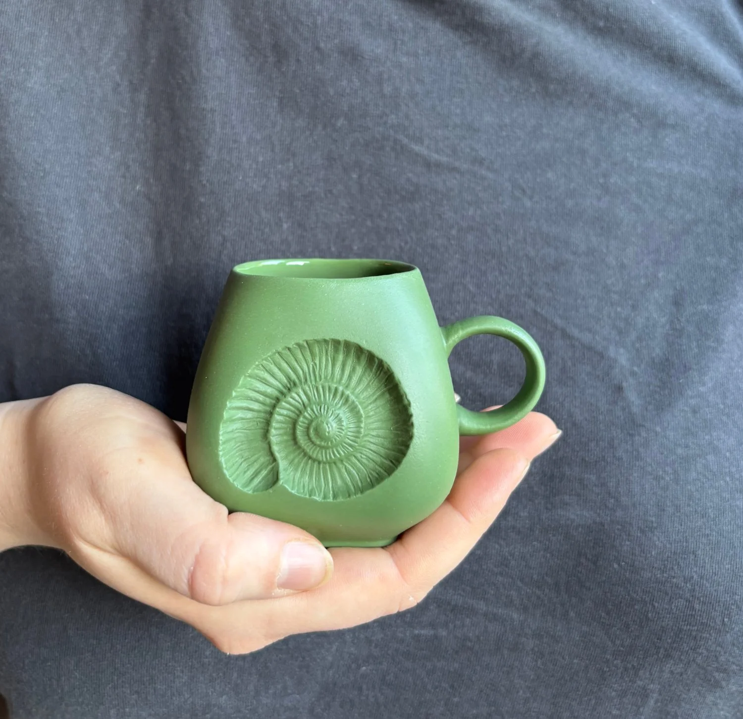 Ammonite espresso mug held chrome green.jpg