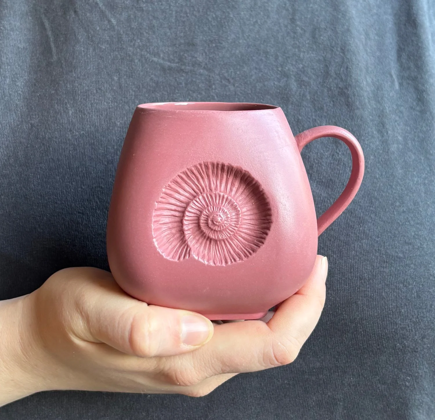 Ammonite Large mug held mulberry.jpg