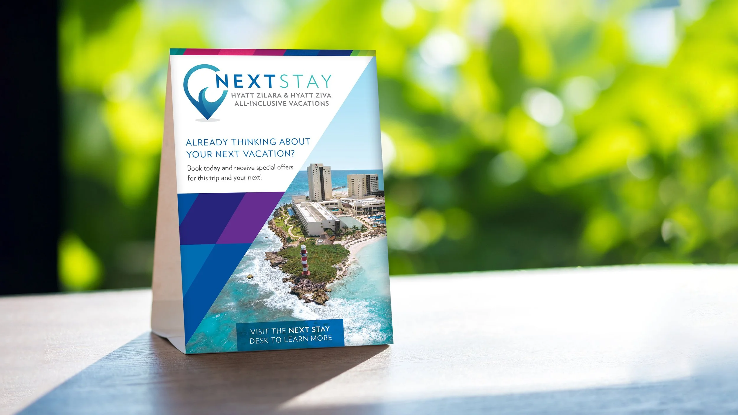 A table tent promoting the Hyatt Next Stay program.