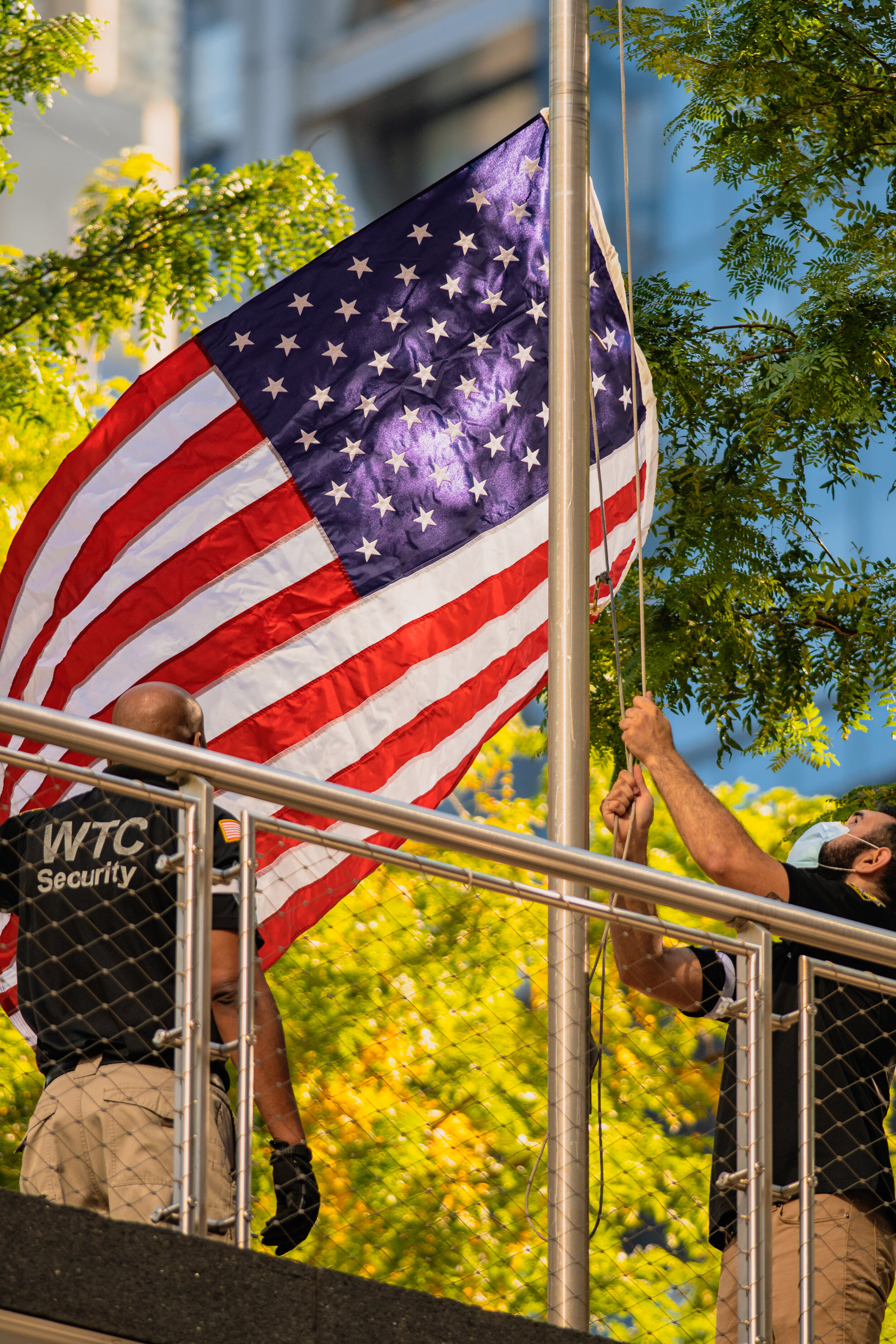  An American flag is raised on the grounds of the 9-11 Memorial.  