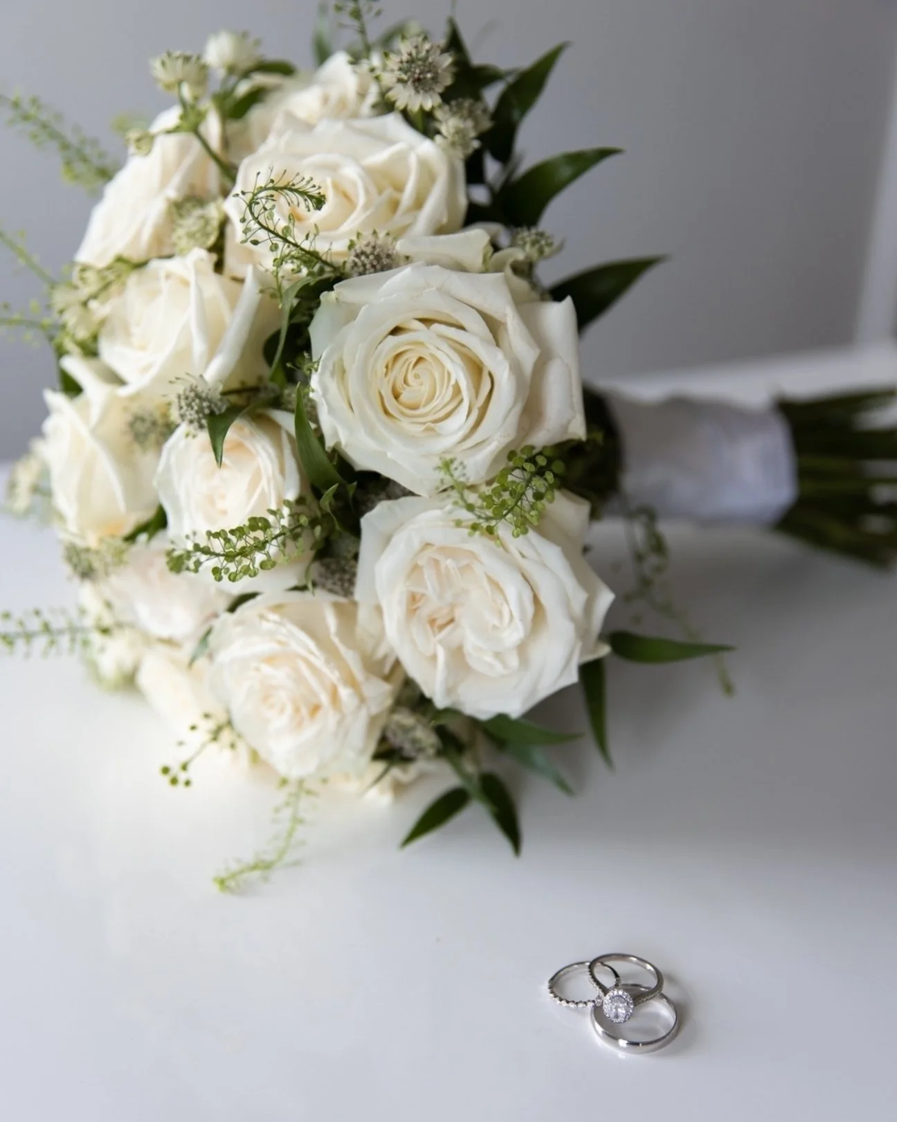 The details set the tone. At the beginning of every wedding day, I make it a mission to capture all of the details that I can so that it's not overlooked.
 
Whether it's the wedding dress, bouquets, rings, perfume/cologne, you name it. If you're a br