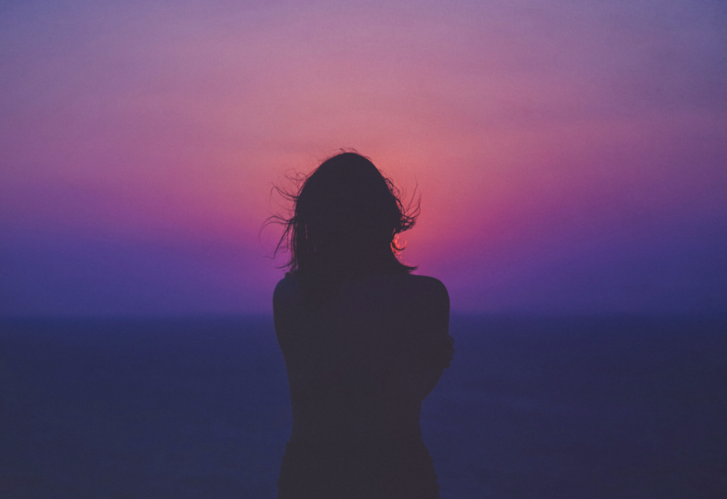 Shadow of woman at sunset