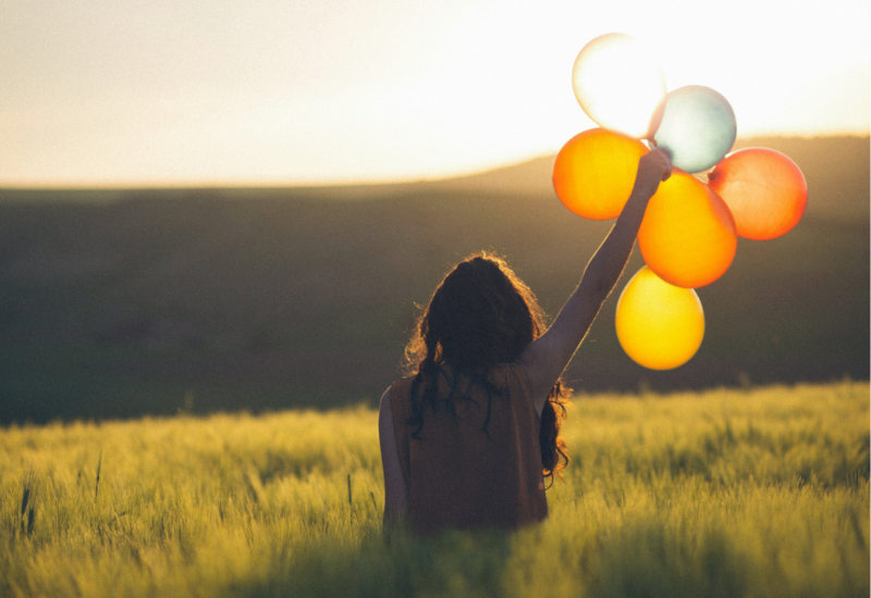 Woman with balloons