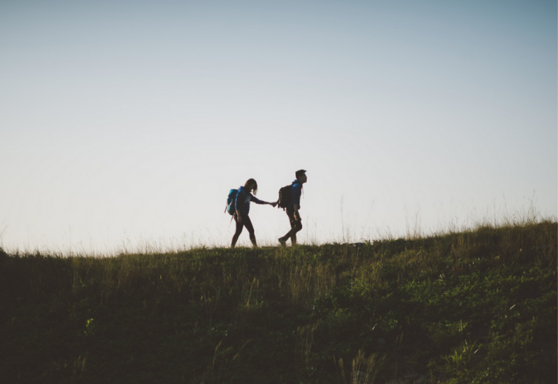 Couple walking on ridge