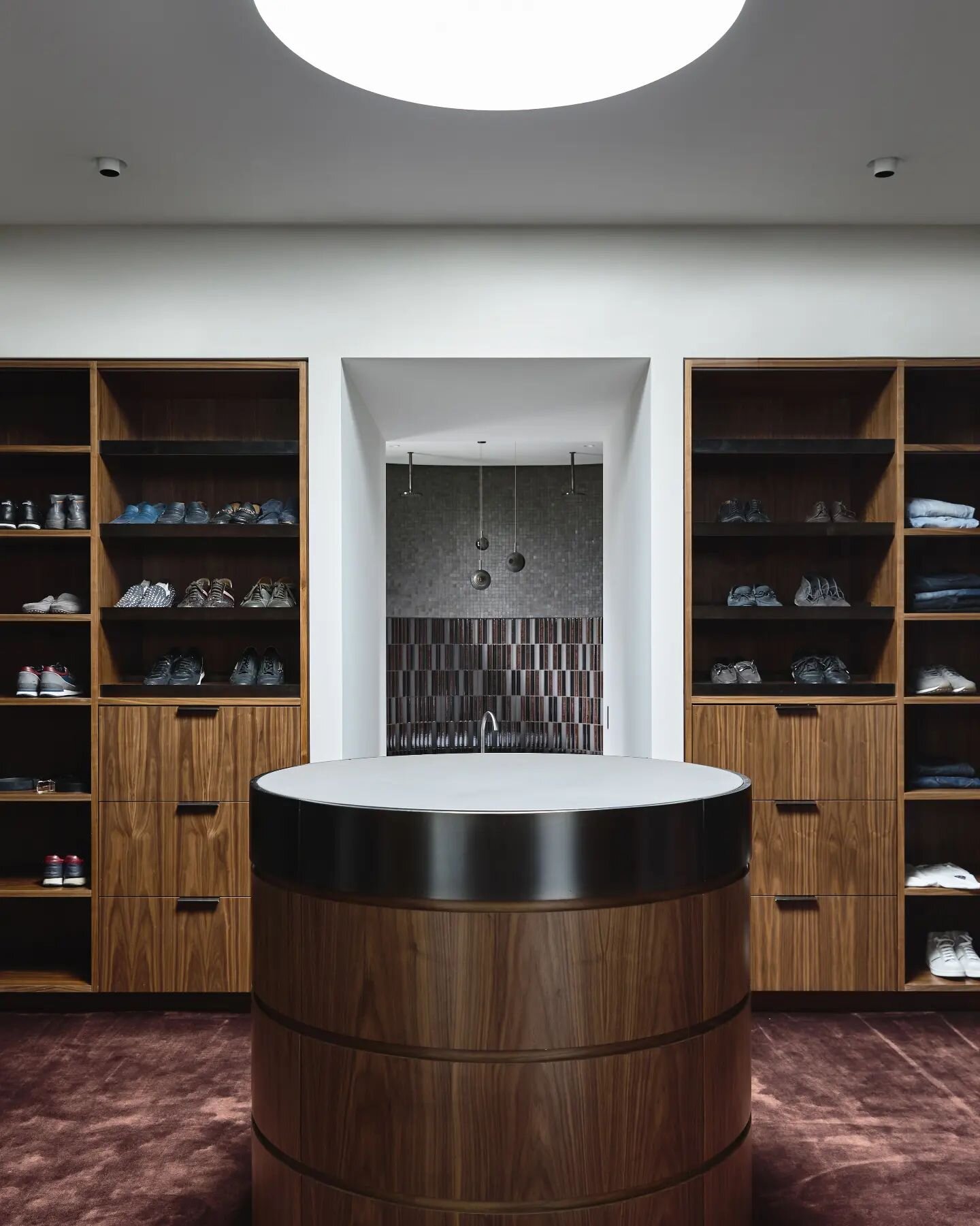 Walk in Wardrobe magic. Walnut and bronze and delicious merlot carpet at our Myvore project. Timeless. Image by @derek_swalwell Joinery by @enc_joinery

#walkinwardrobe #designedinmelbourne #walnut #luxe #contemporarydesign #Interiors #interior4inspo
