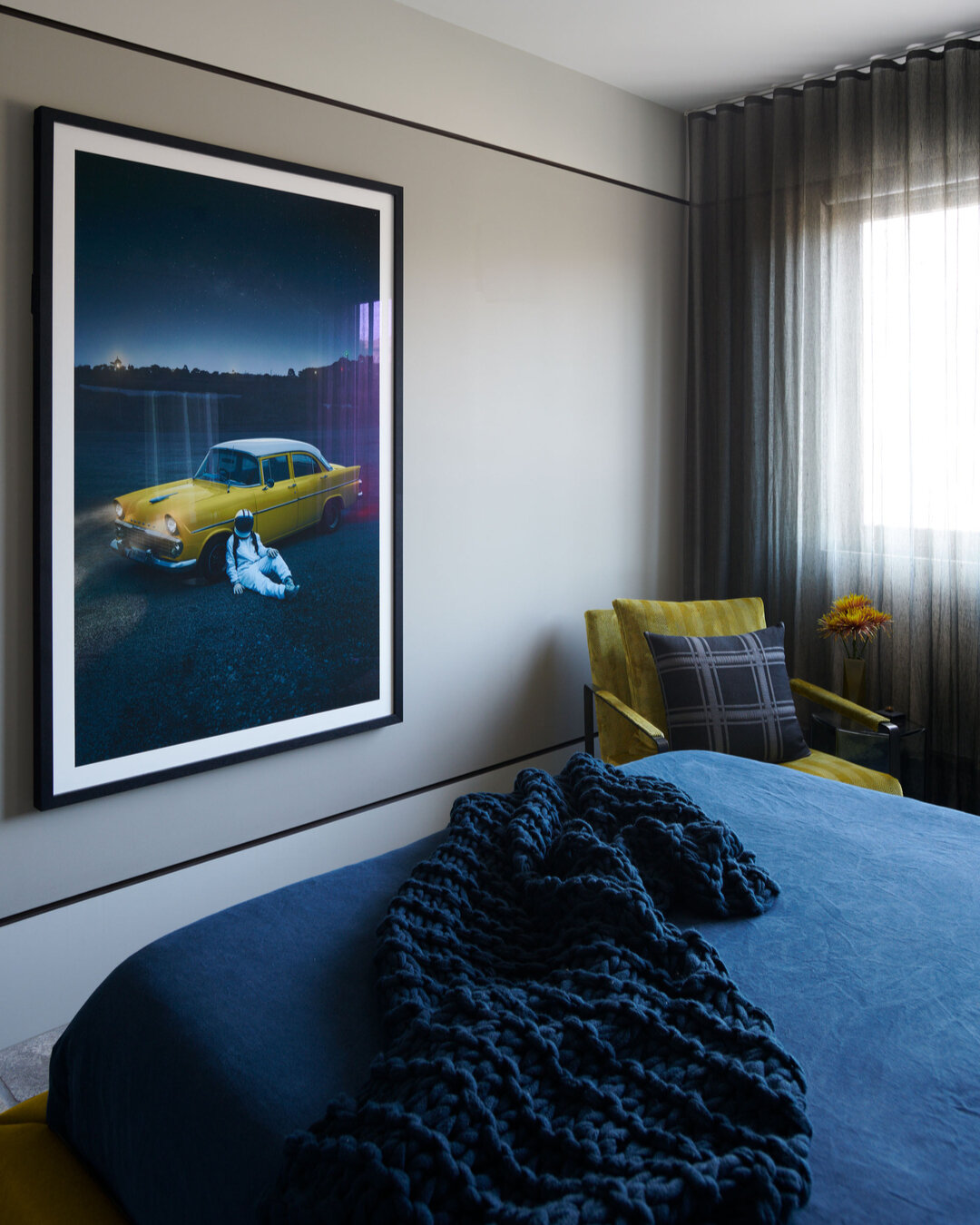 DANKS STREET, HOME &amp; STUDIO - The chartreuse upholstery of the bedhead adds a vibrant touch, echoed in the custom upholstery of the occasional chair, creating a cohesive and stylish look. An overscale photographic artwork becomes the focal point.