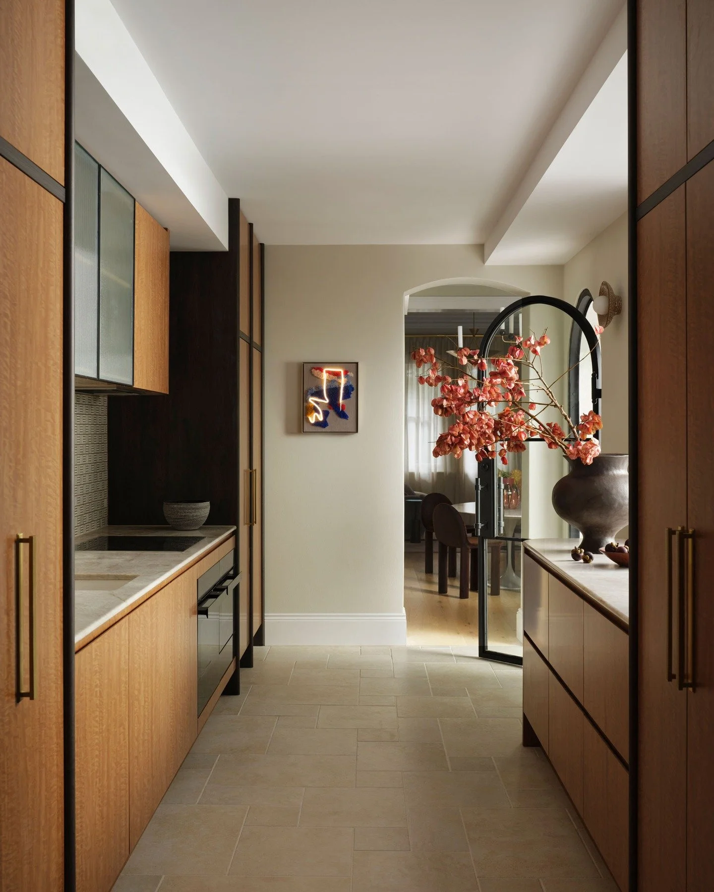 CHIPPENDALE TERRACE HOUSE - The morning light moves through the galley kitchen, catching on figured veneer joinery and sparkling on the quartzite bench tops.
The palette is restrained, but the composition is intentional. A rhythmic passage between sp