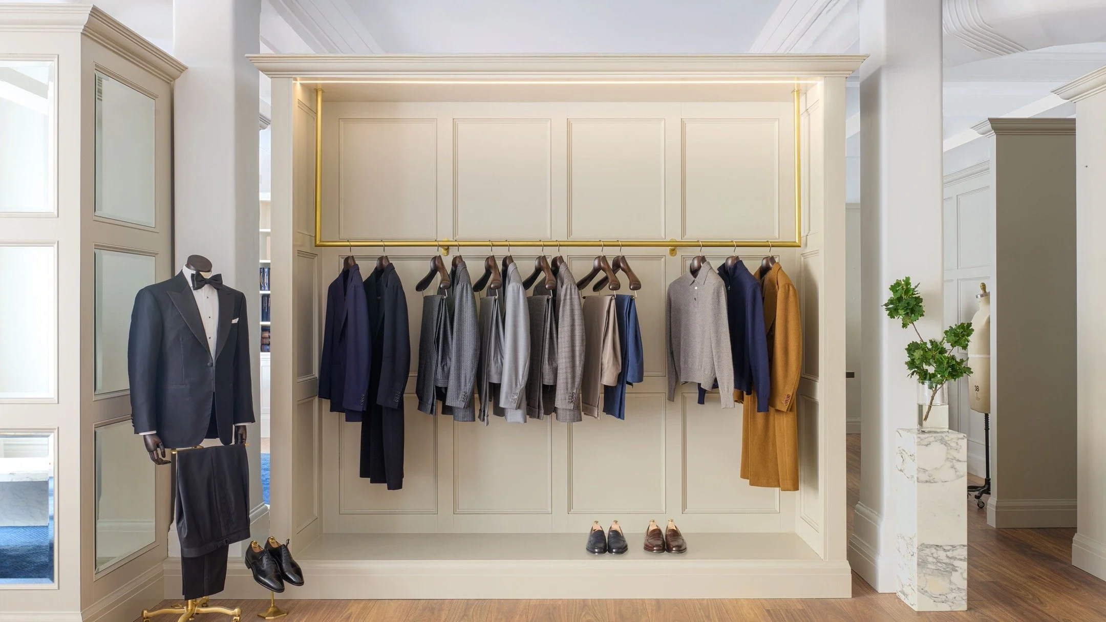 J.H. Cutler &mdash; the showroom as a stage.
Brass detailing, marble and panelled joinery frame the garments with precision. Nothing decorative, nothing unnecessary just a setting built to honour craft at its highest level.

Interior Design &amp; Dec