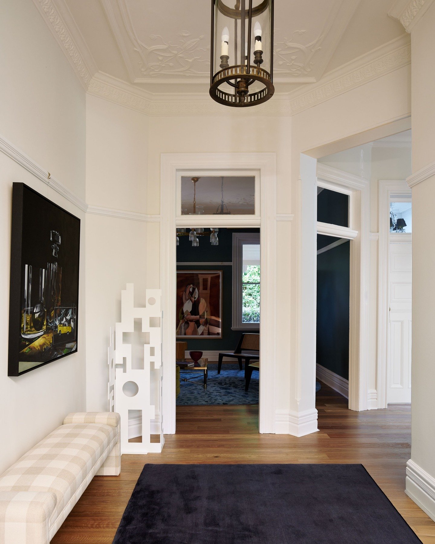 KILLARA HOUSE &mdash; A hallway defined by grand proportions. Original plasterwork and millwork frame a sequence of rooms, while contemporary art and a deep indigo mohair runner introduce contrast against pale walls and timber floors.
Interior Design