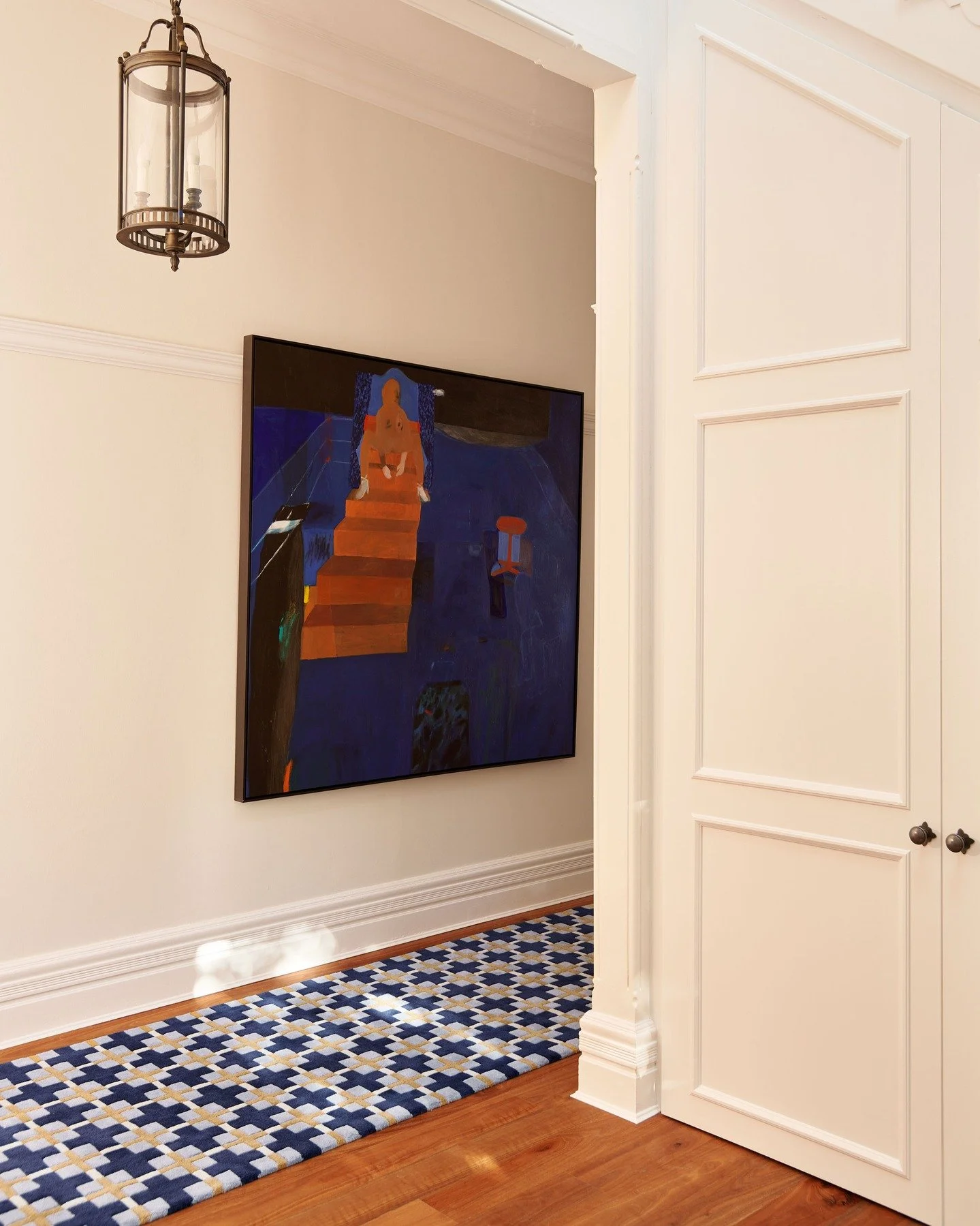 KILLARA HOUSE &mdash; A corridor punctuated by colour. The oversized canvas is slightly dwarfed by the scale of the house, yet sits confidently against crisp panelling and timber floors. Our custom cobalt-and-ochre runner draws the eye through the th