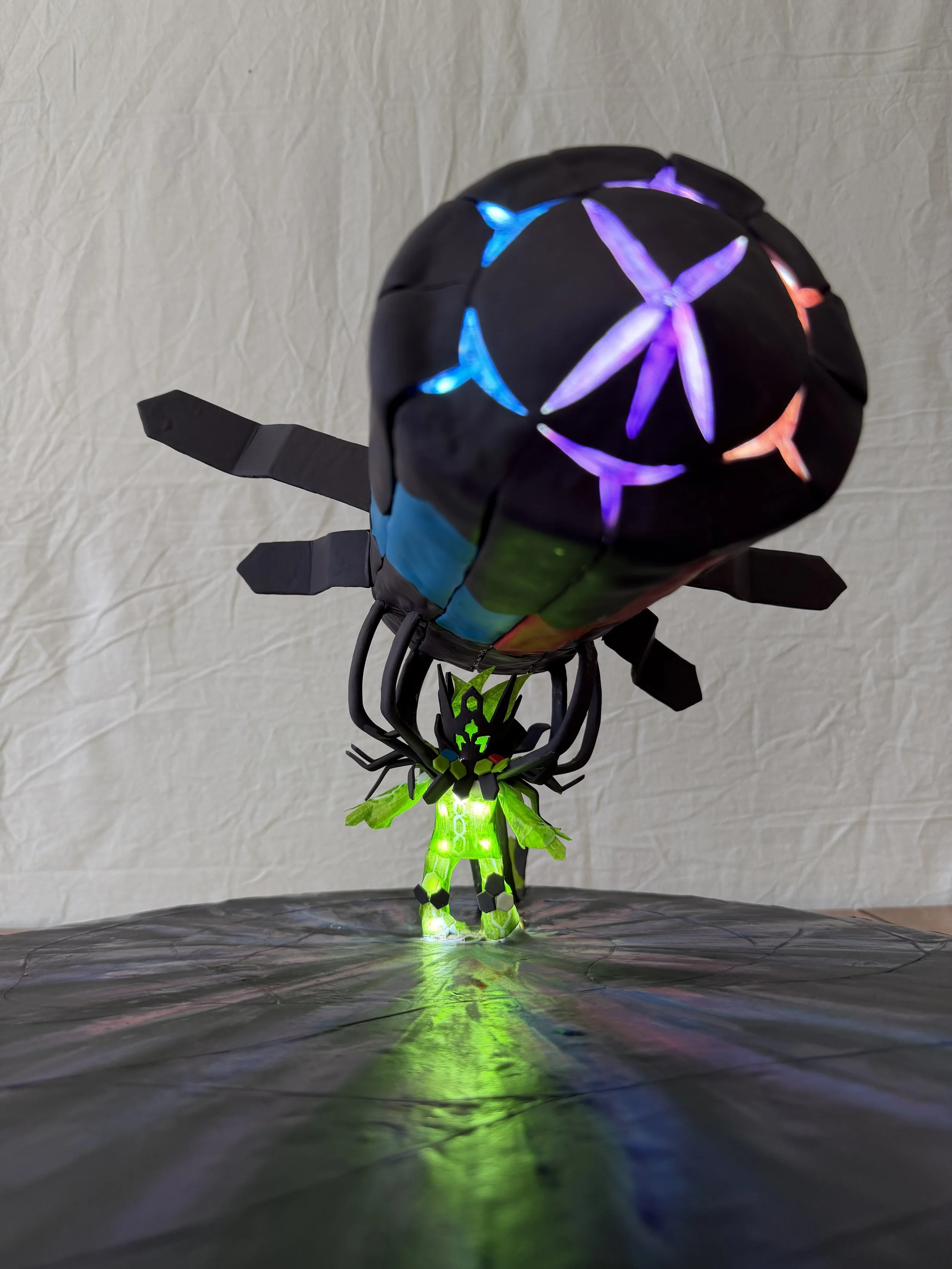 Cake of glowing green Mega Zygarde holding a big rocket