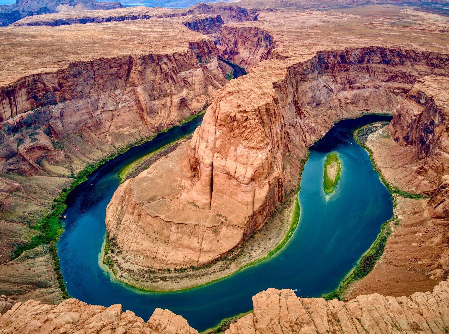 Horseshoe Bend is a meander of the Colorado River in a horseshoe-shape located in the United States, near the town of Page, Arizona. Horseshoe Bend is at a distance of 5 miles (8.0 km) downstream from the Lake Powell and Glen Canyon Dam within Glen C