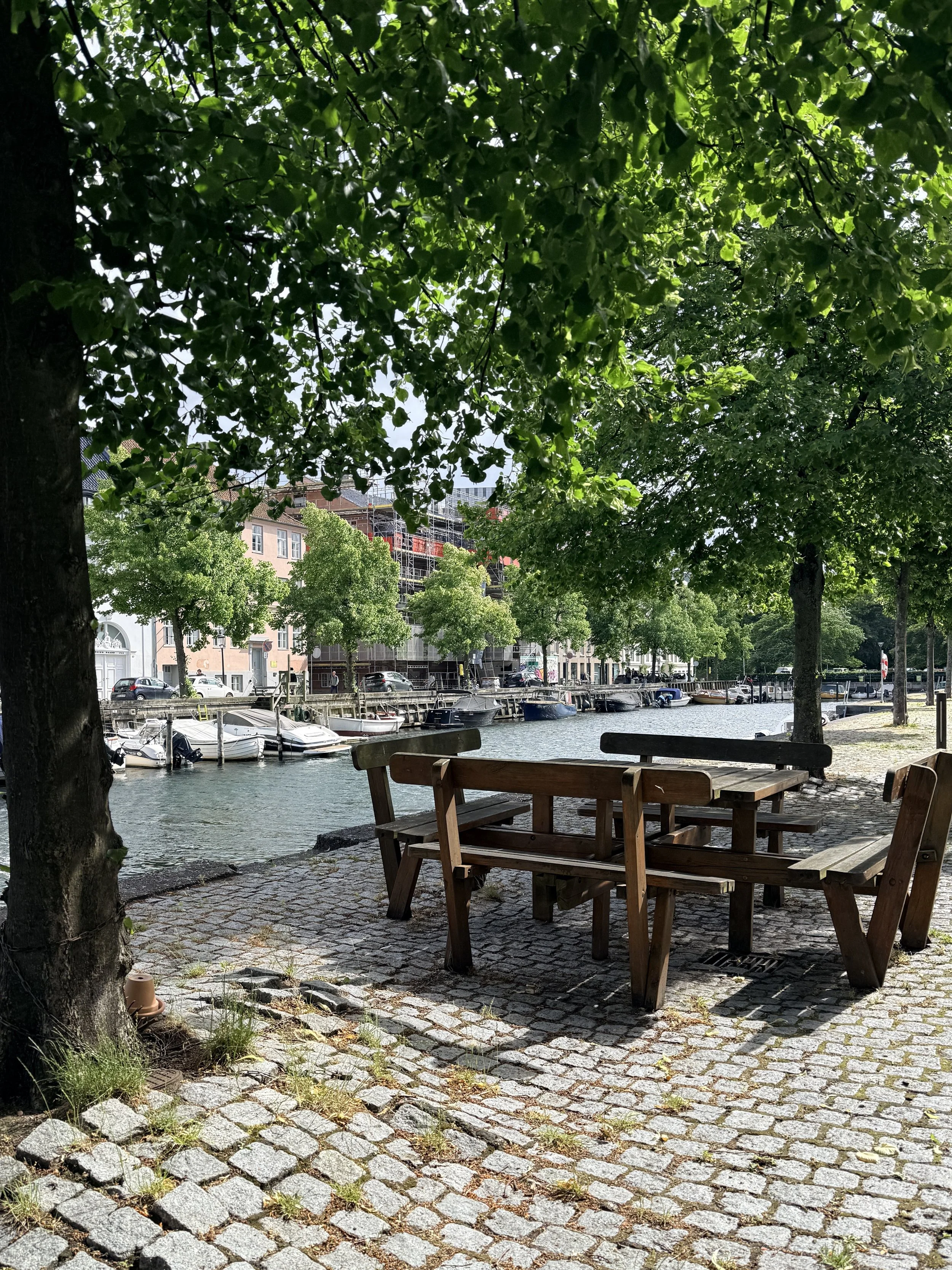 Public picnic table on the canal's edge in Copenhagen