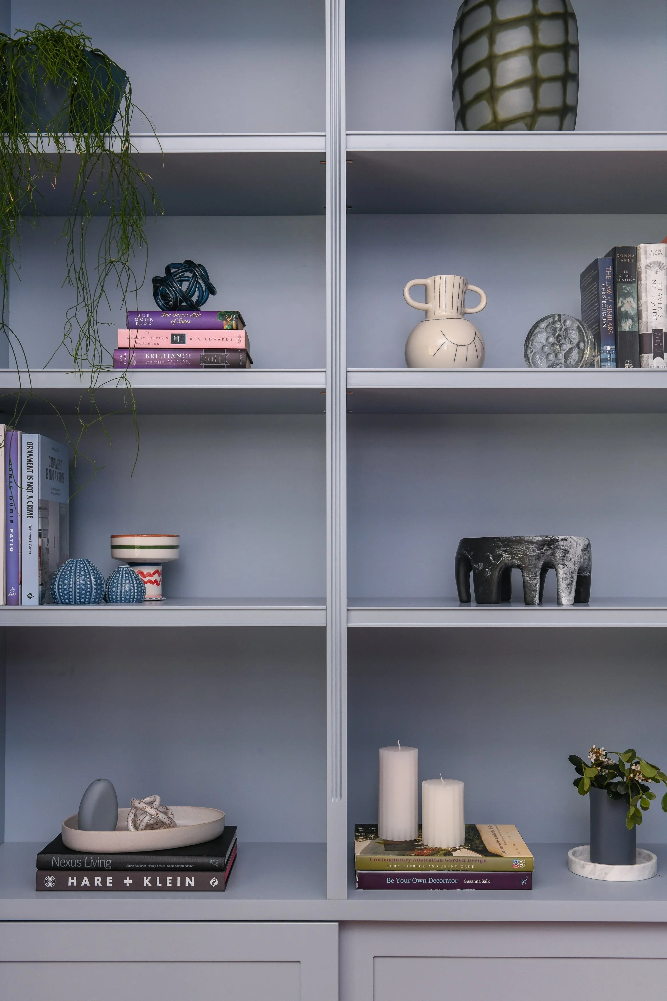 Custom grey-blue bookshelves in home office