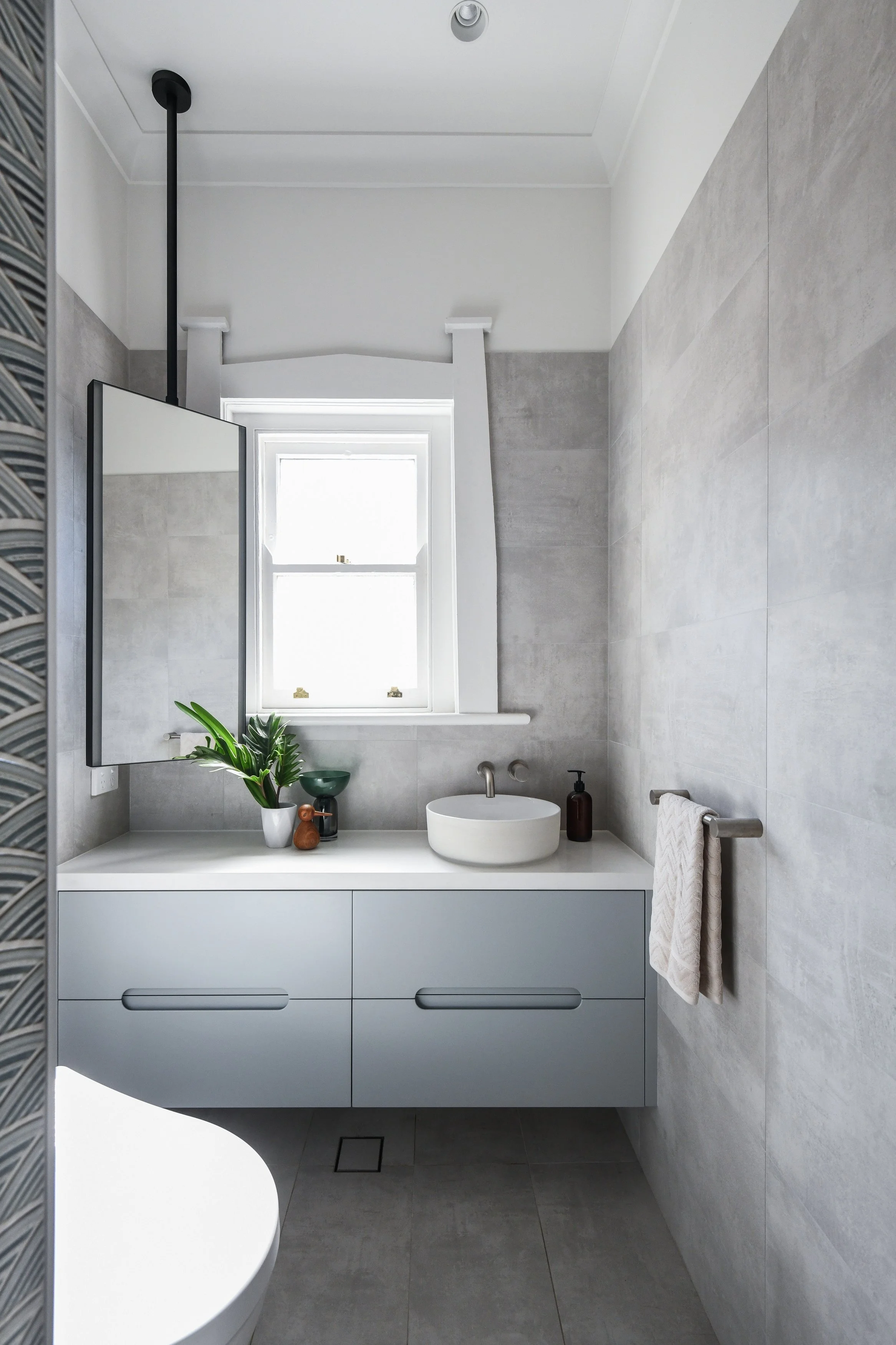 Small bathroom in California Bungalow in Fairlight with blue vanity and ceiling hung mirror