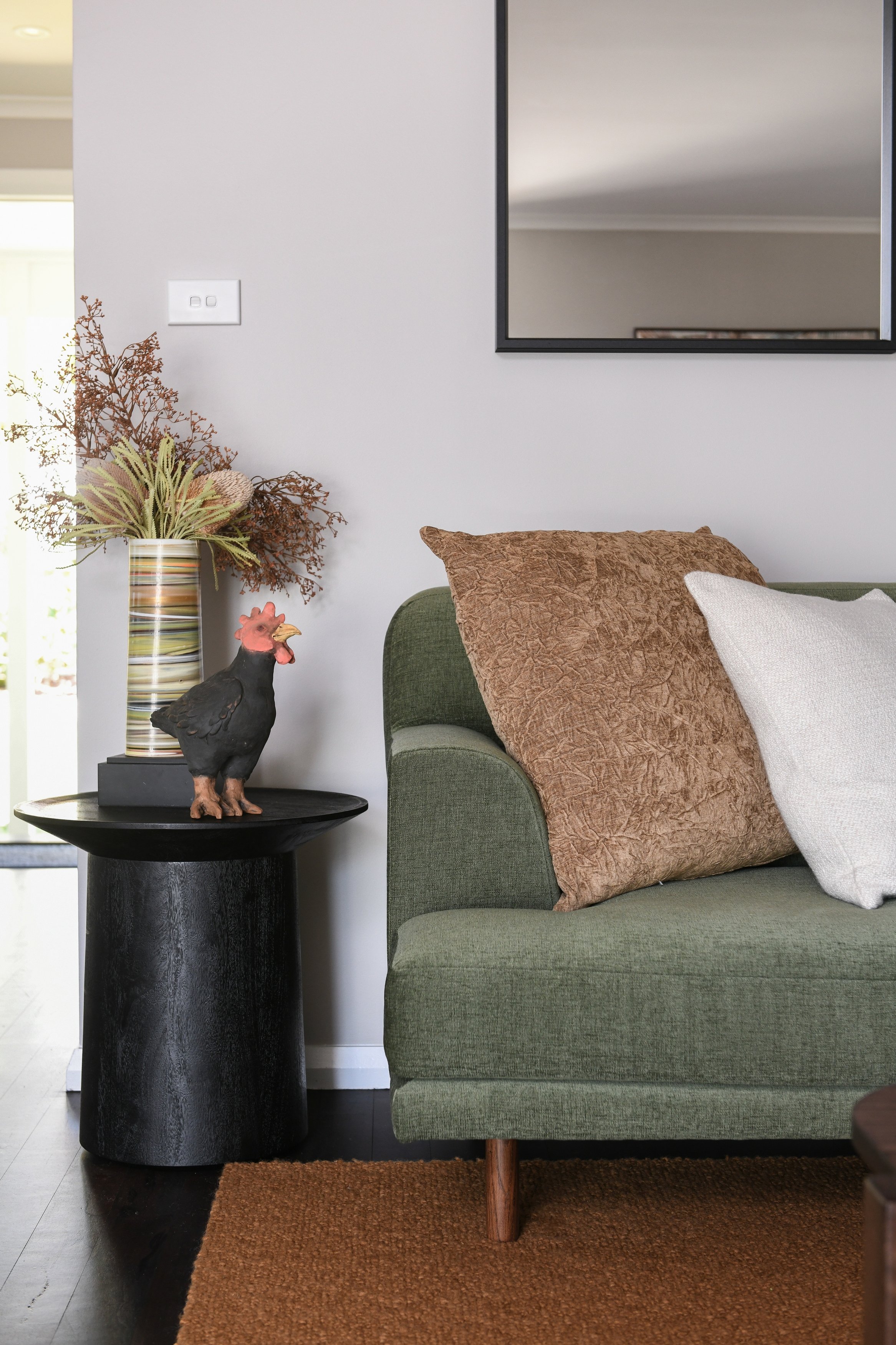 blue mountains living room with greens, ochres and dark timber