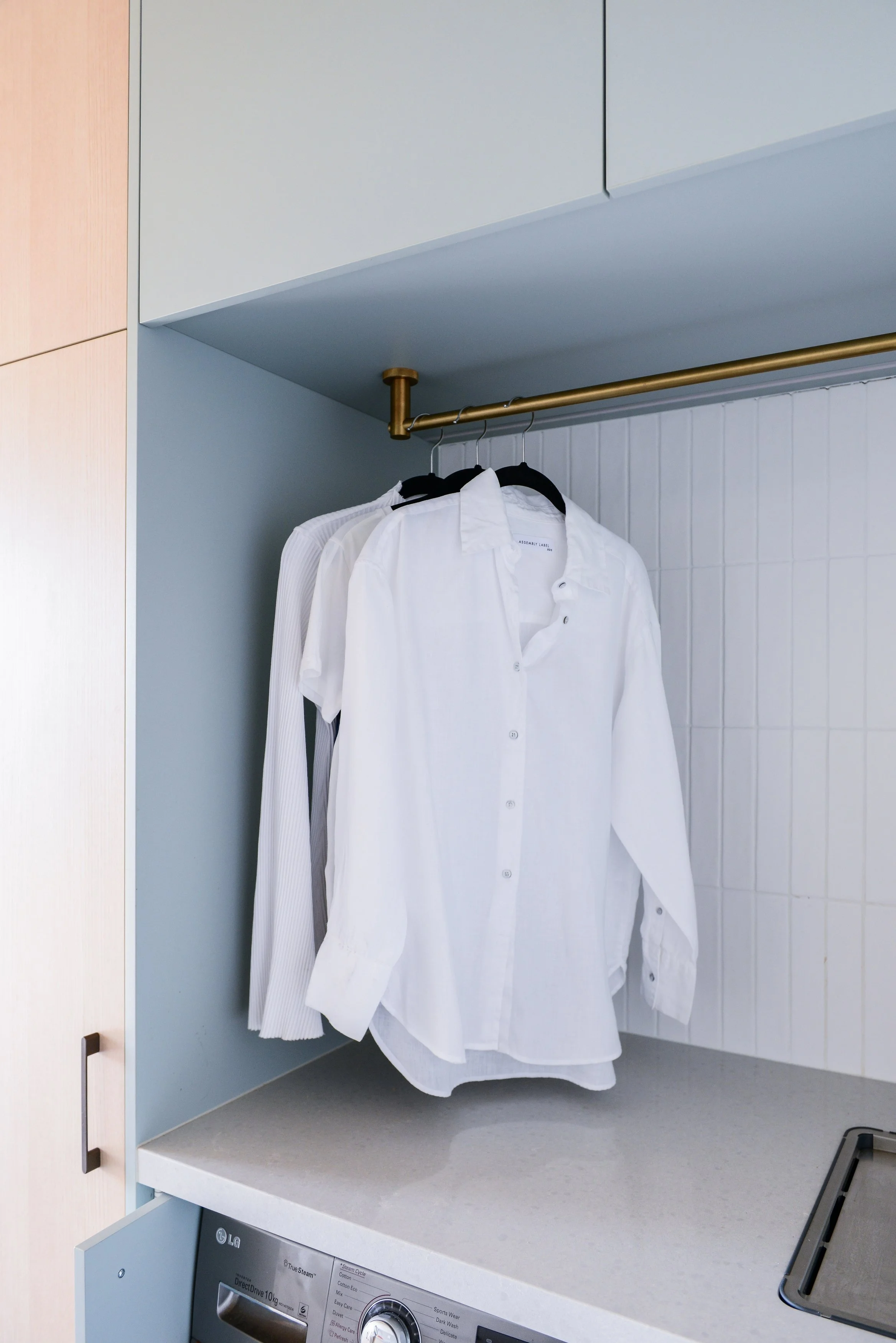 Laundry room with overbench hanging rail in Laminex Spinifex