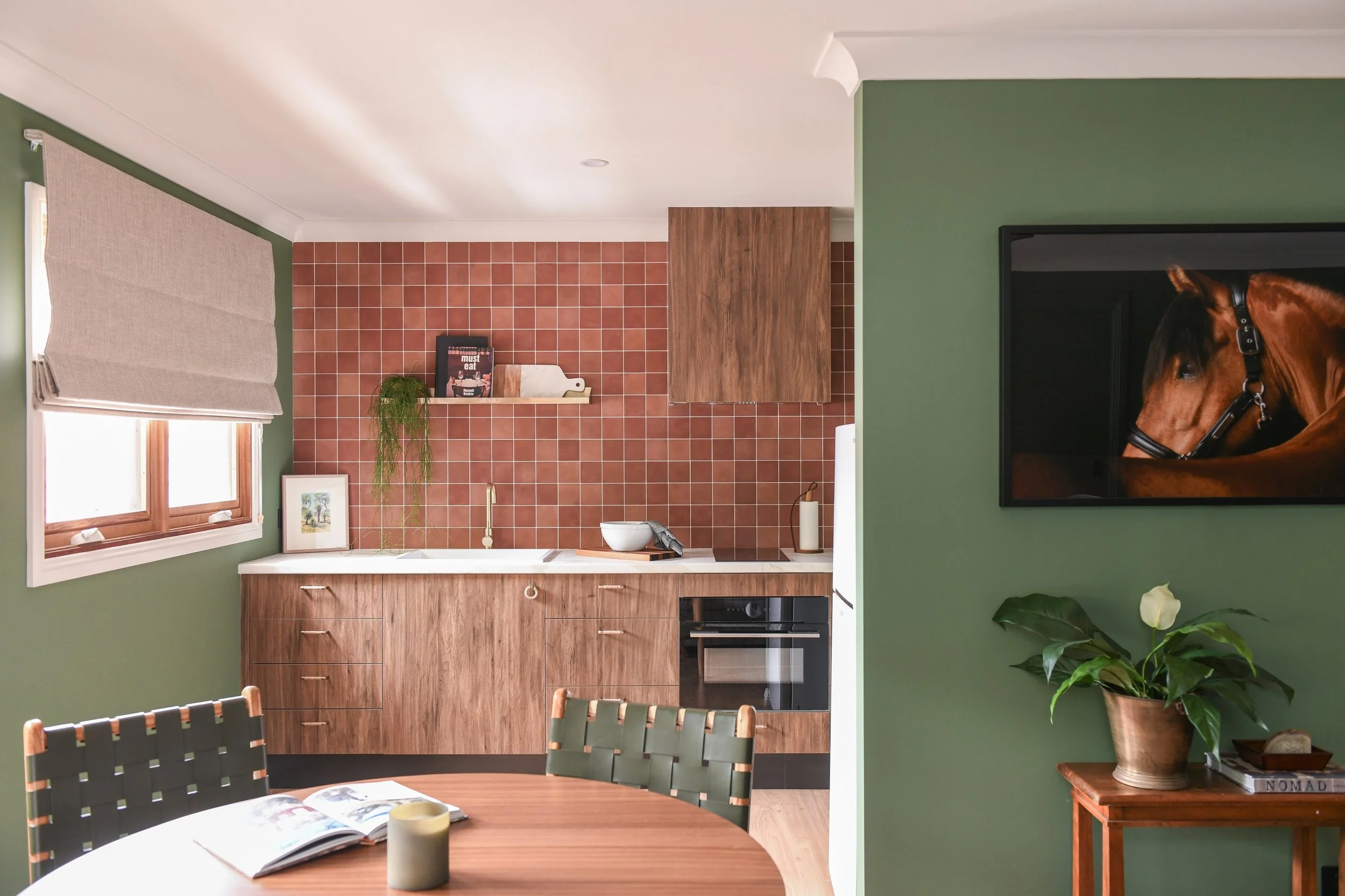 Rich timber kitchen with terracotta splashback tile