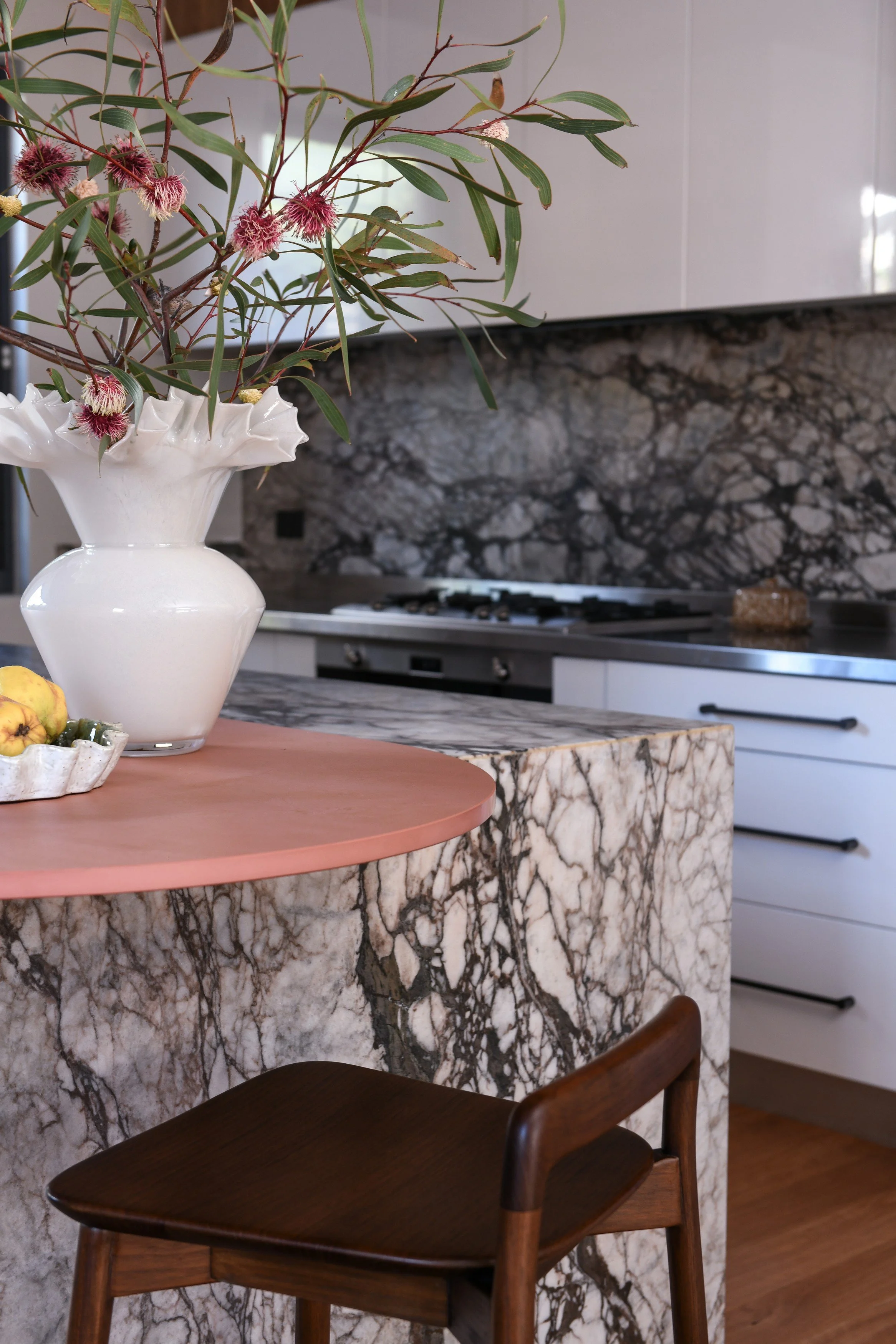 Terracotta breakfast bar and natural stone island