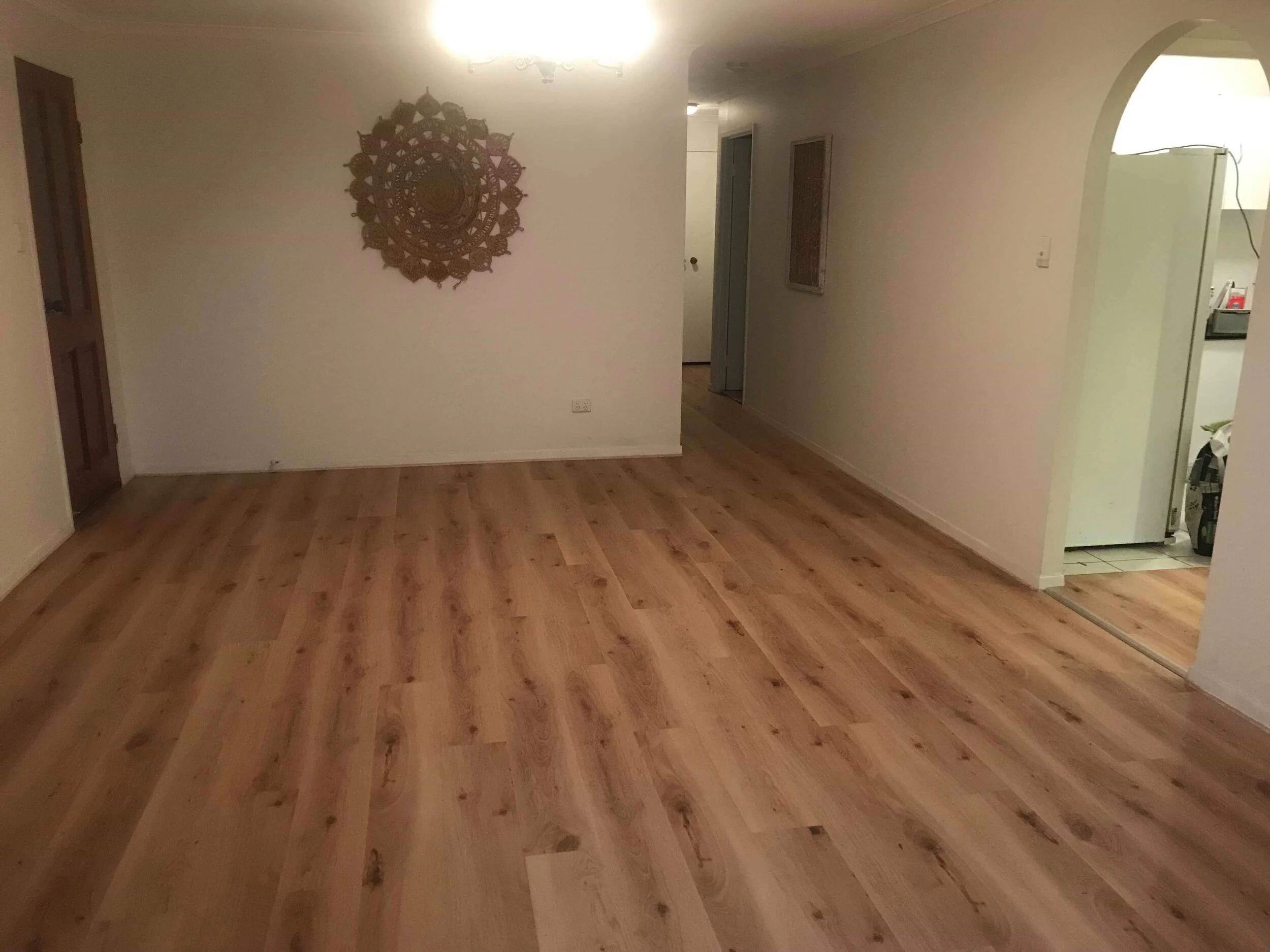 AFTER: We replaced the old carpet with vinyl flooring from Premium Floors (Titan Vinyl Country Oak).