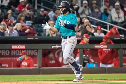 Haniger's parents receive ball from first putout