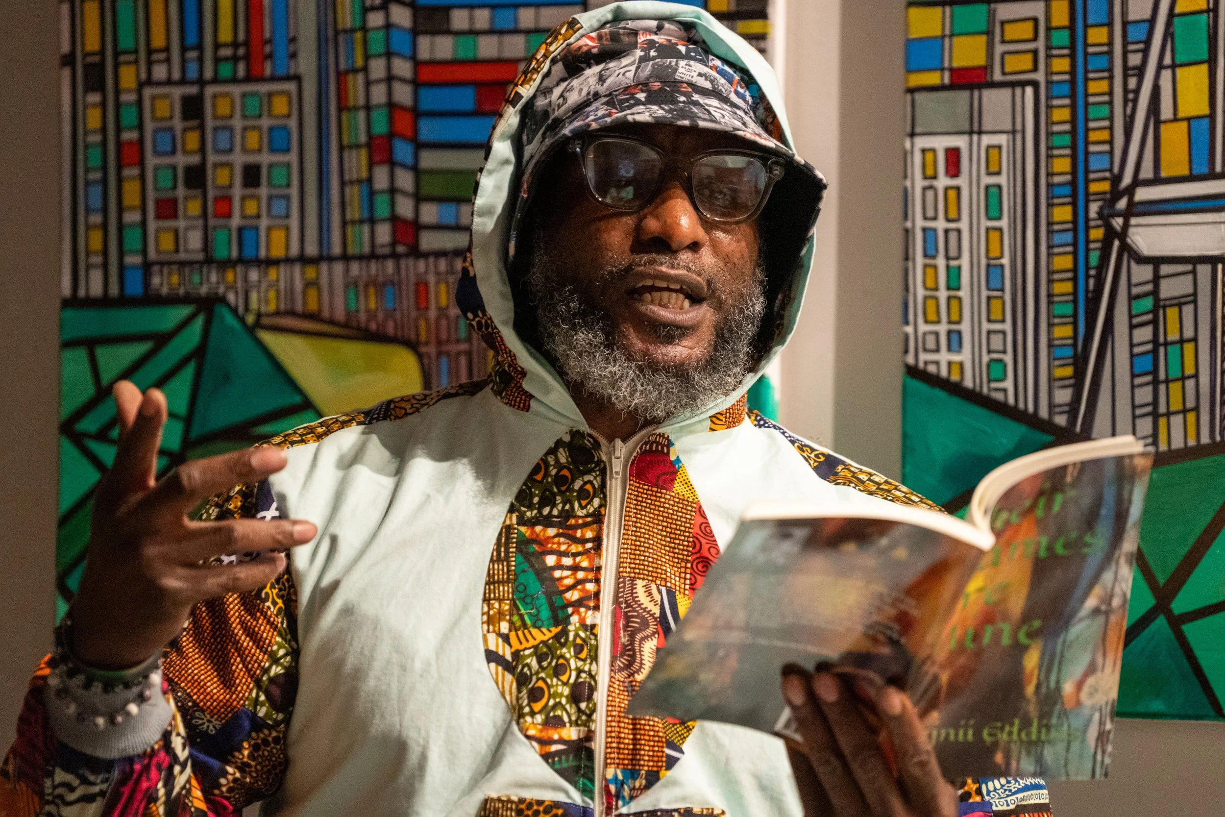 PHOTOS: Iconic Poet Rajnii Eddins Hosts Reading at TASWIRA