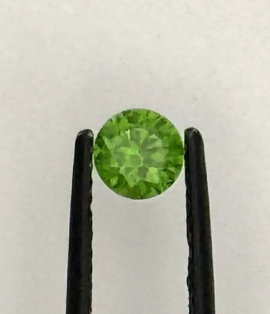 Demantoid Garnet, 0.60 carats, Russian, no heat. Lovely 'horsetail' inclusions.