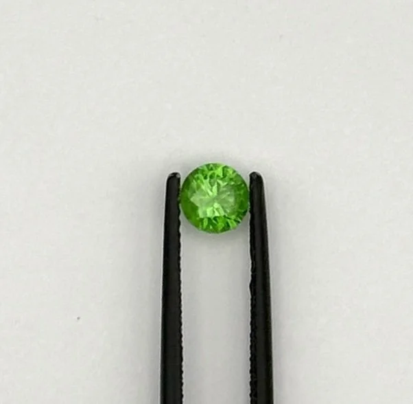 Demantoid Garnet, 0.62 carats, Russian, no heat. Lovely 'horsetail' inclusions.