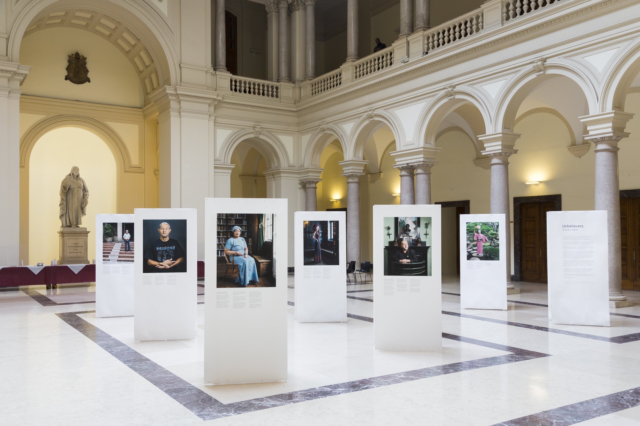  Exhibition of Aubrey Wade's 'Unbelievers' project at the Gregorian Pontifical University in Rome, Italy, during the Understanding Unbelief programme's capstone conference, 28 - 30 May 2019. The portraits and stories in the exhibition give an insight